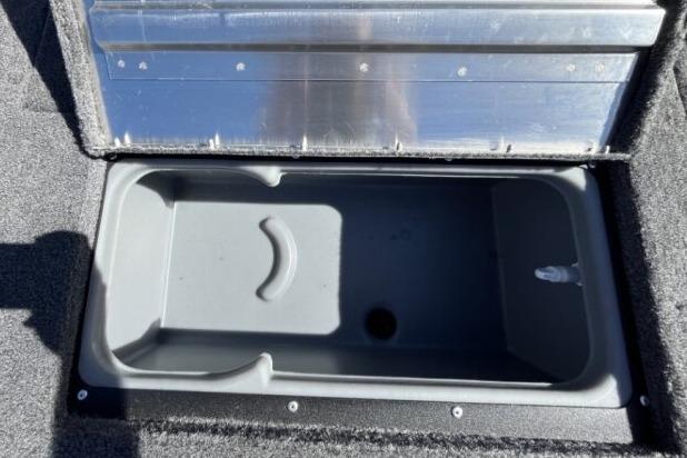 2025 Tracker Super Guide V-16 T storage compartment, open and empty, with a gray interior.