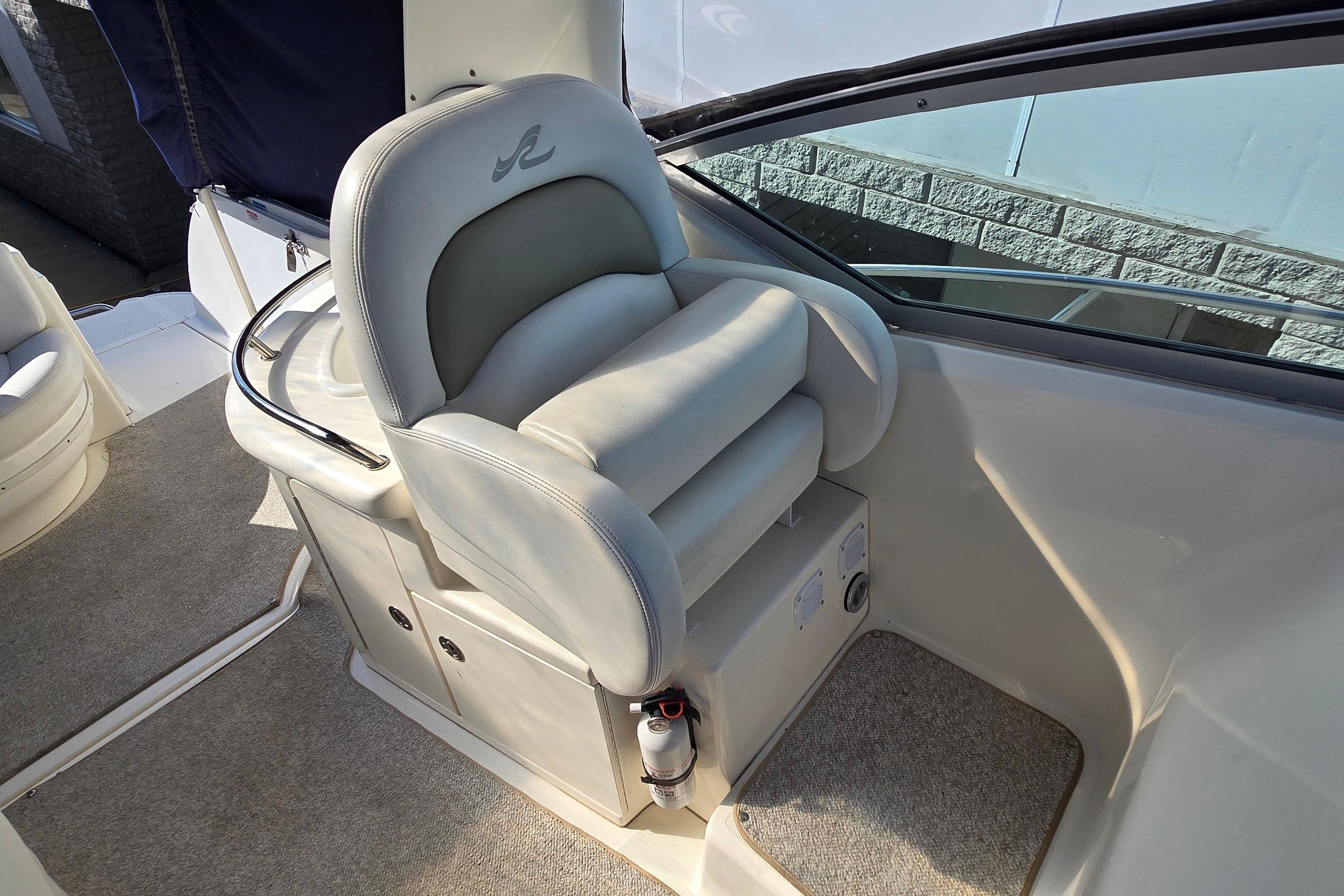 Captain's seat on a 2007 Sea Ray 340 Sundancer boat, featuring plush upholstery.
