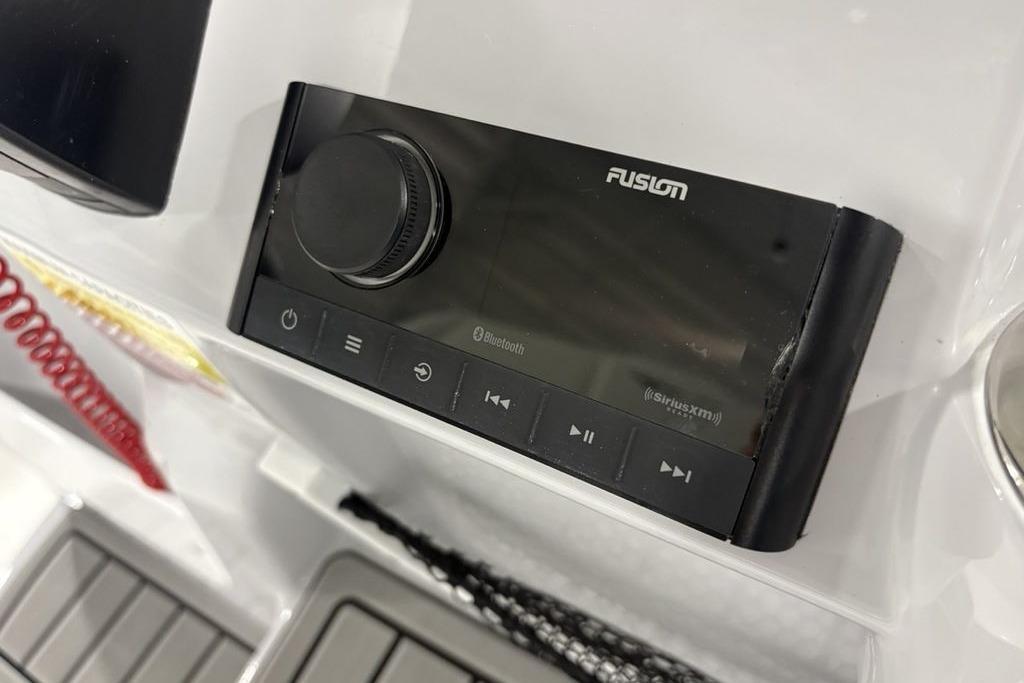 Fusion audio system on 2026 Tidewater 2210 Carolina Bay boat dashboard.