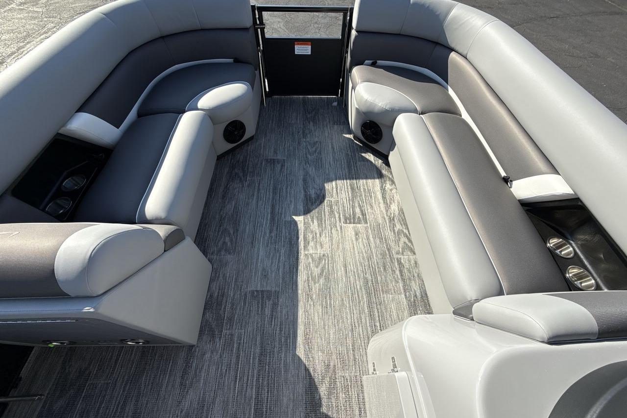 2026 Landau Island Breeze 232 Sport Cruise interior with gray seating and flooring.