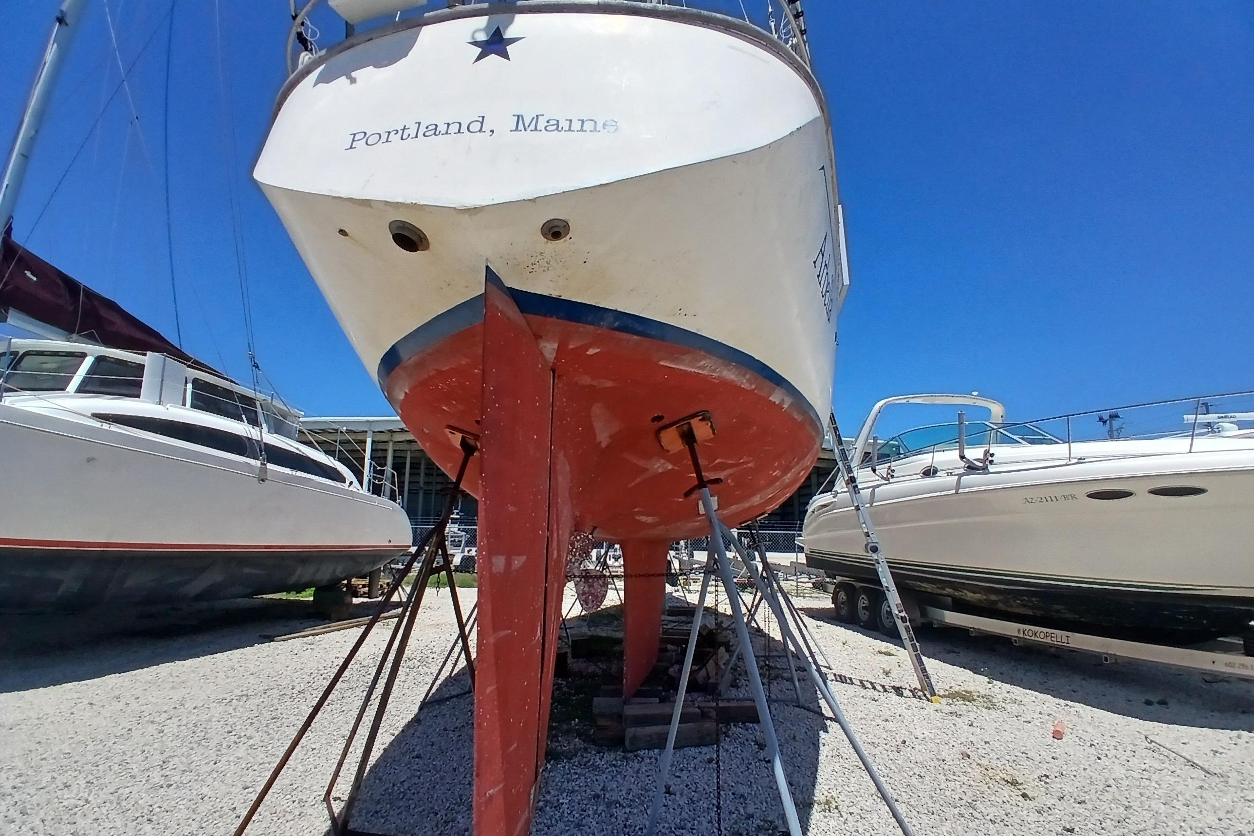 Sailboat Kaufman Skye 51, 1981, docked in Portland, Maine, with clear blue sky.
