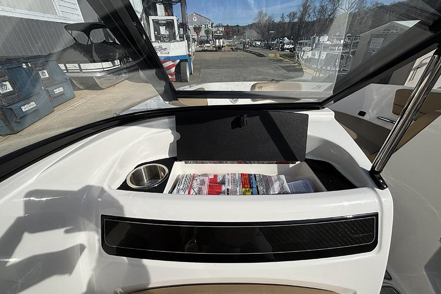 2023 Bayliner VR5 Bowrider OB interior with storage compartment and cup holder.