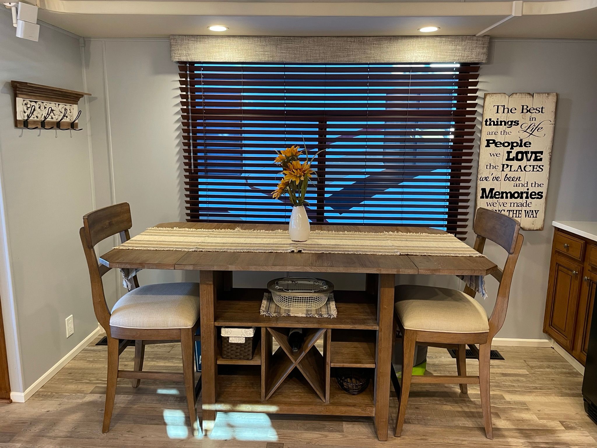 Interior of a 2001 Sumerset houseboat with dining table and decor.