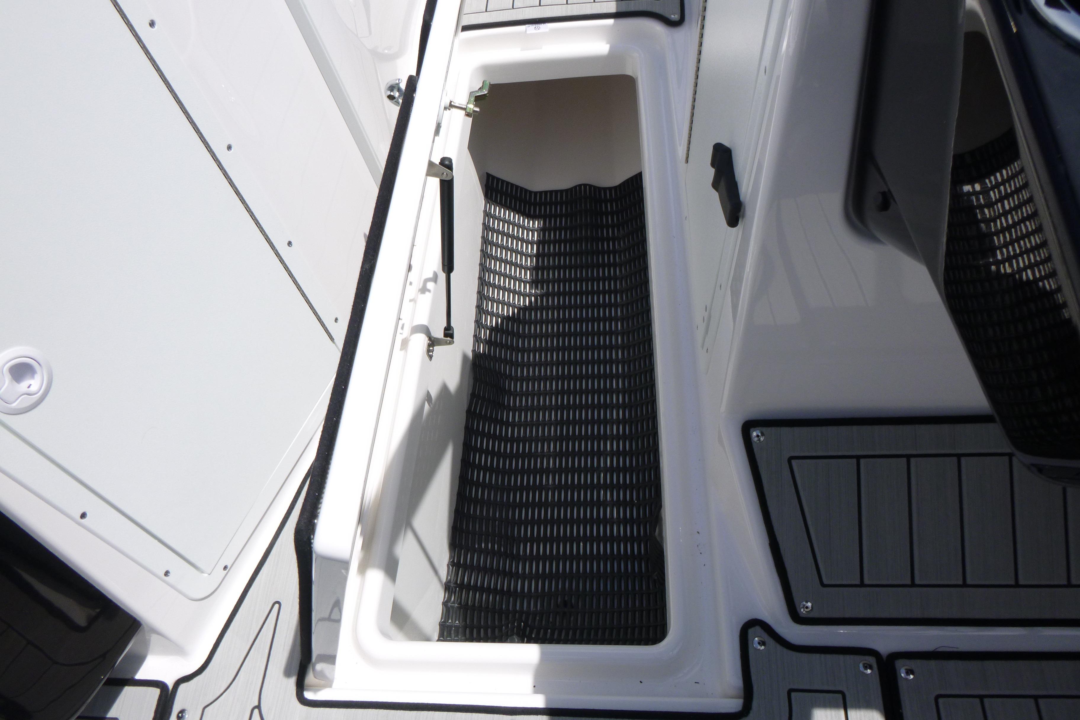 2026 Yamaha Boats 222S storage compartment with non-slip flooring.