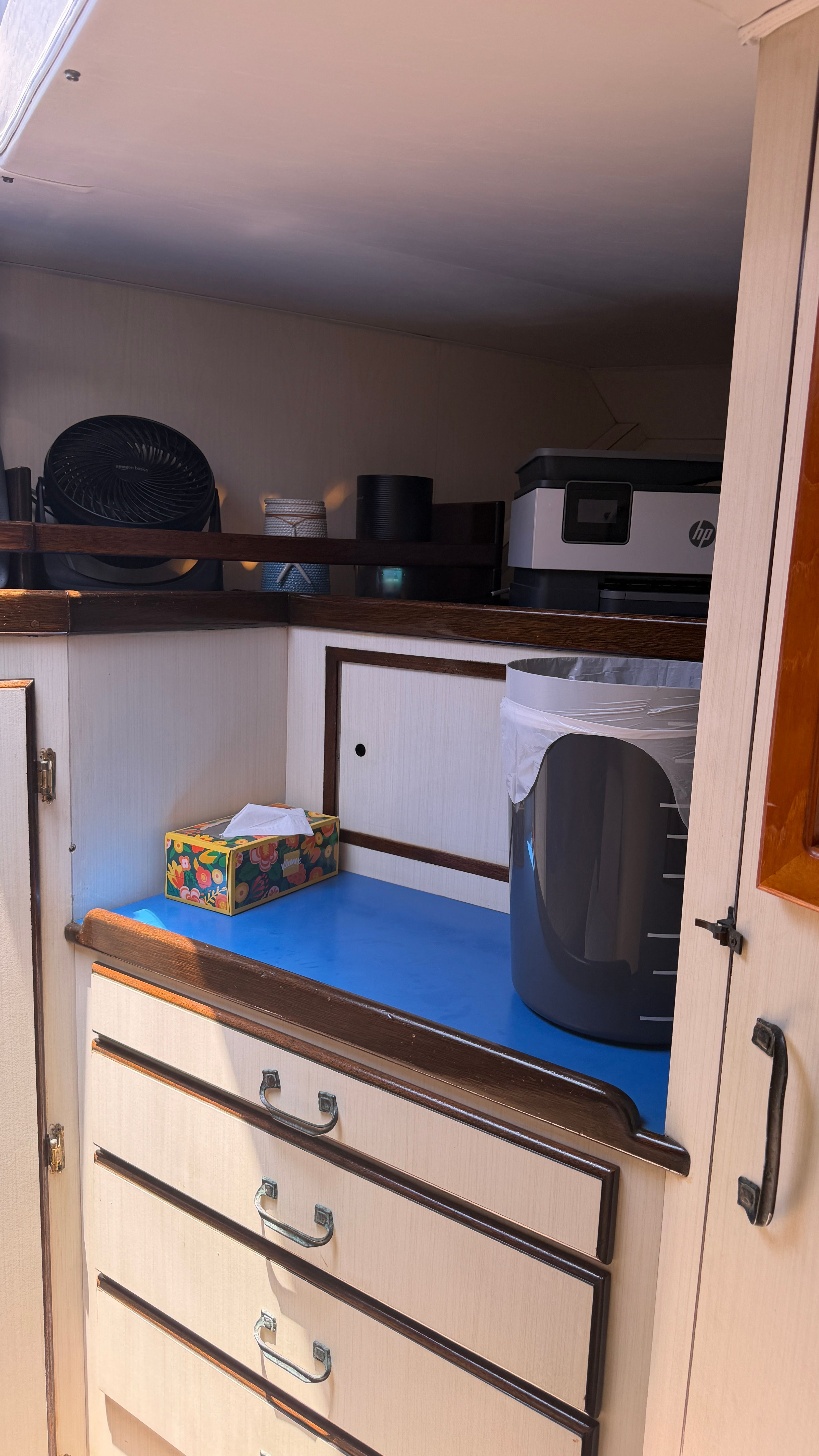 Interior of a 1966 Drake Yachtfisher with cabinets and counter space.