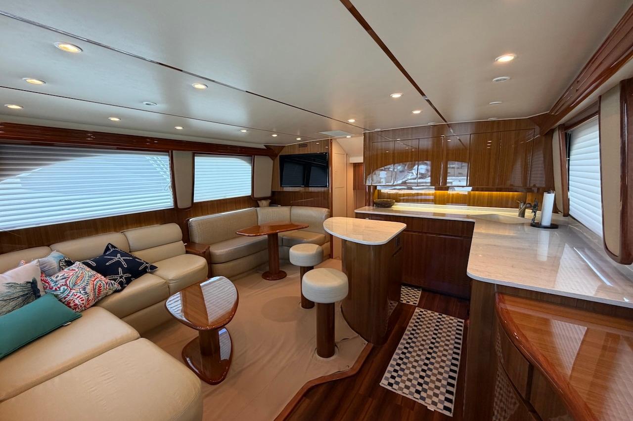 Luxurious interior of a 2012 Viking 50 Convertible yacht with elegant seating and modern amenities.