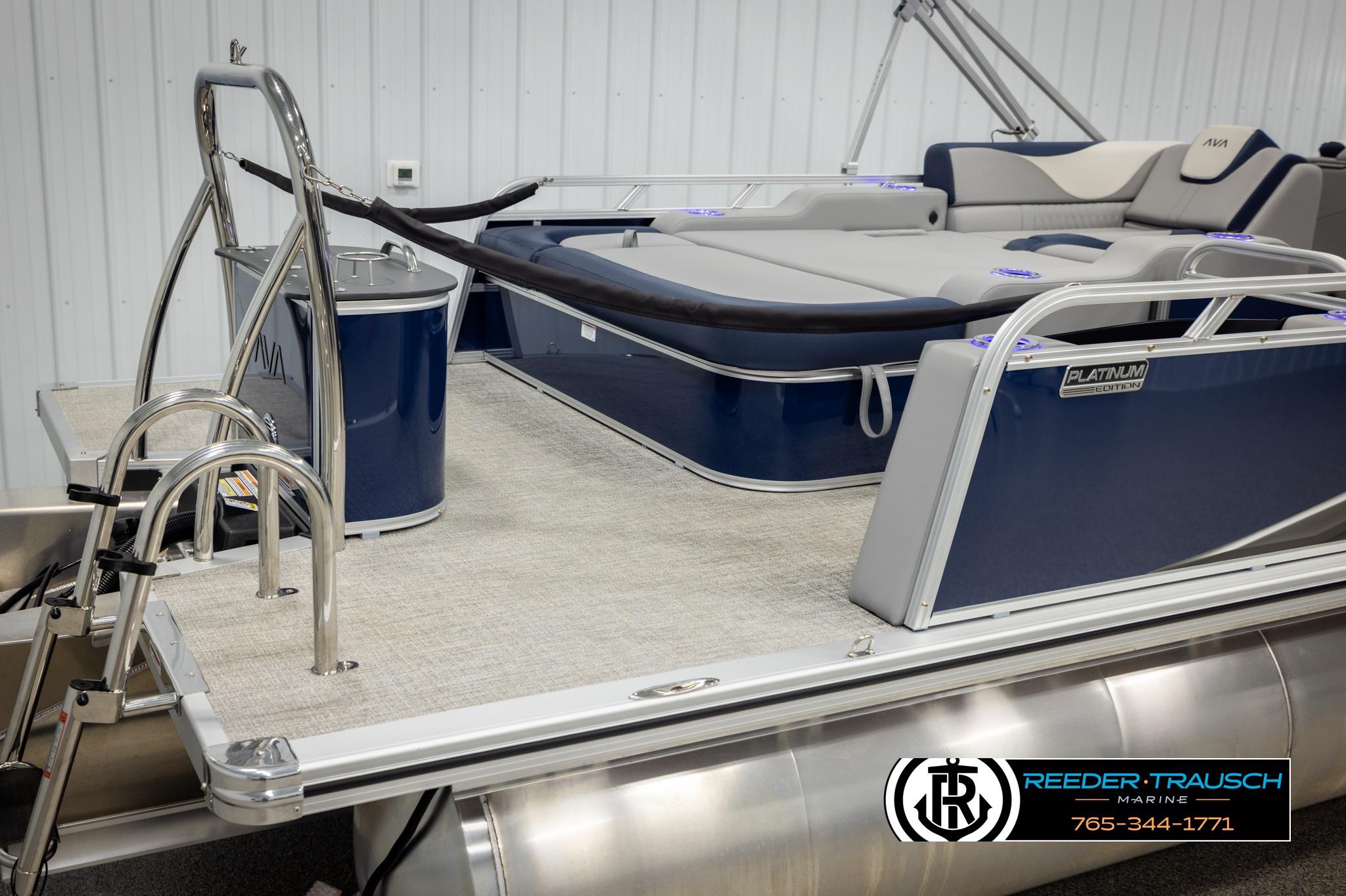 2026 Avalon LSZ VRB pontoon boat with luxurious seating and sleek design in showroom.