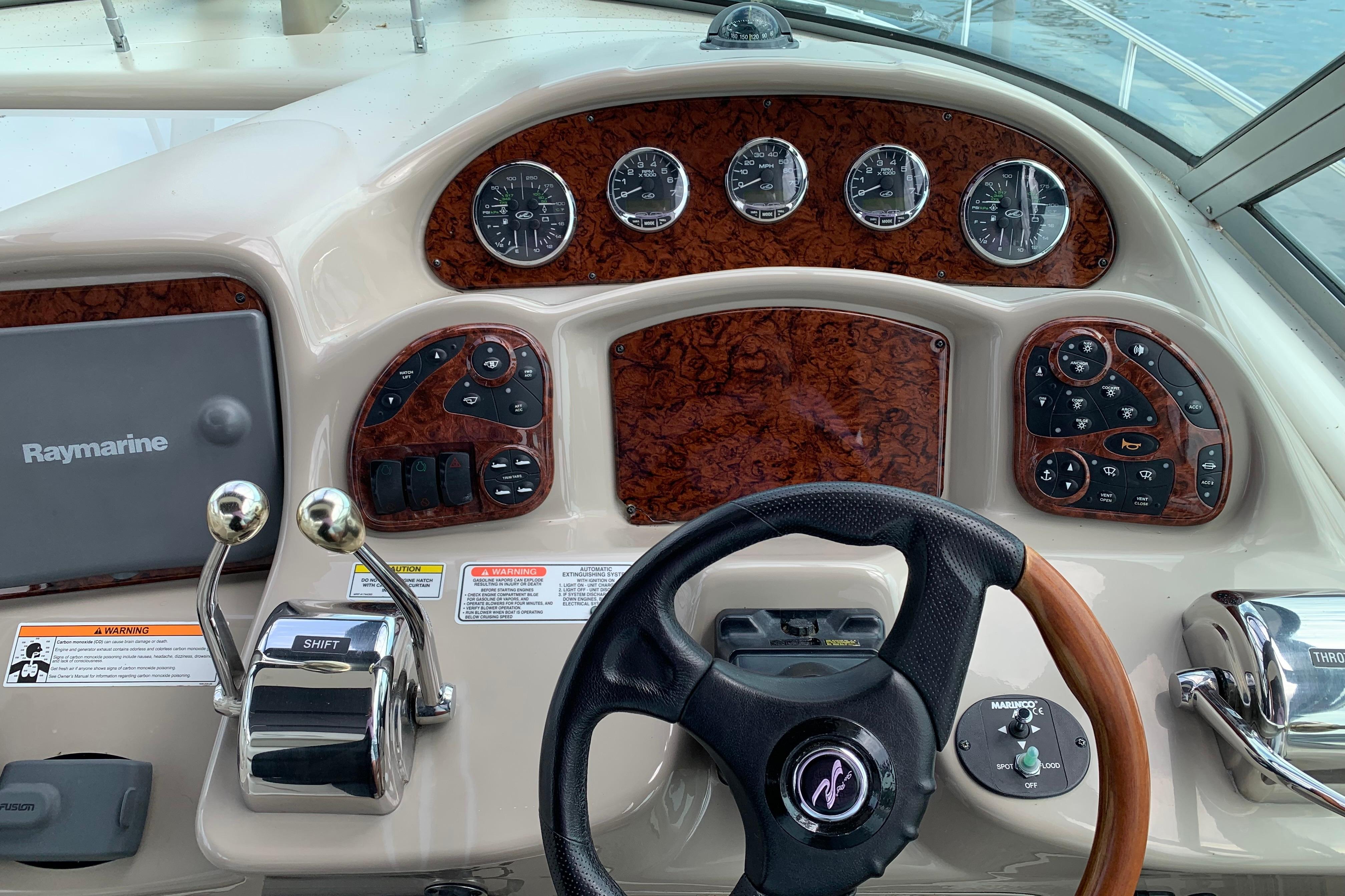 Dashboard of a 2007 Sea Ray 340 Sundancer boat with steering wheel and controls.