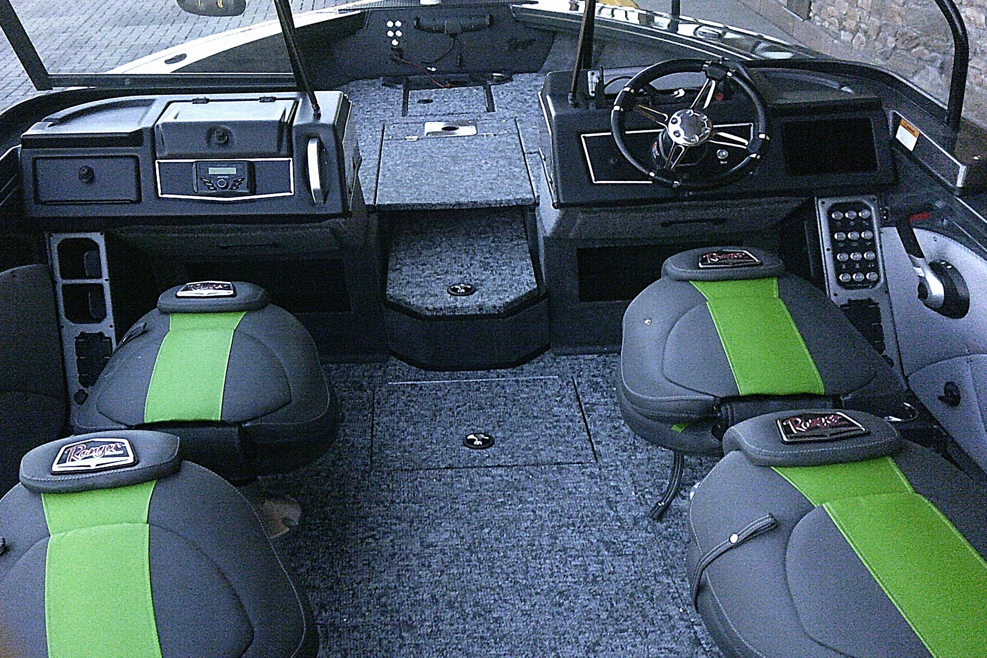 2026 Ranger VX1888 WT boat interior with green-accented seats and modern dashboard.