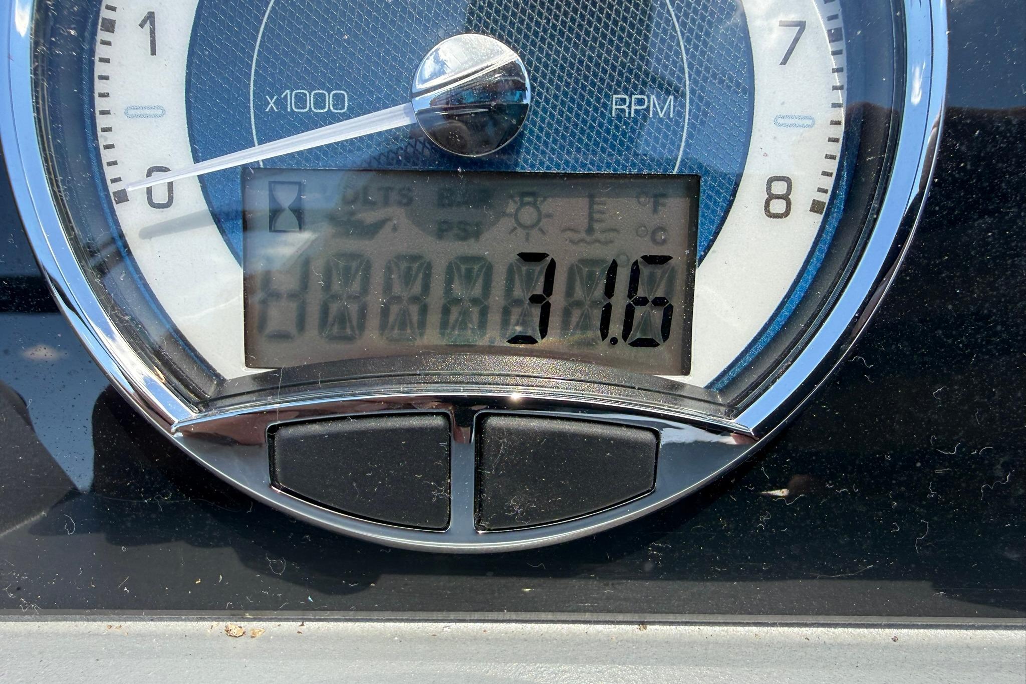 Close-up of 2023 Barletta Corsa 23U tachometer displaying 3116 RPM.