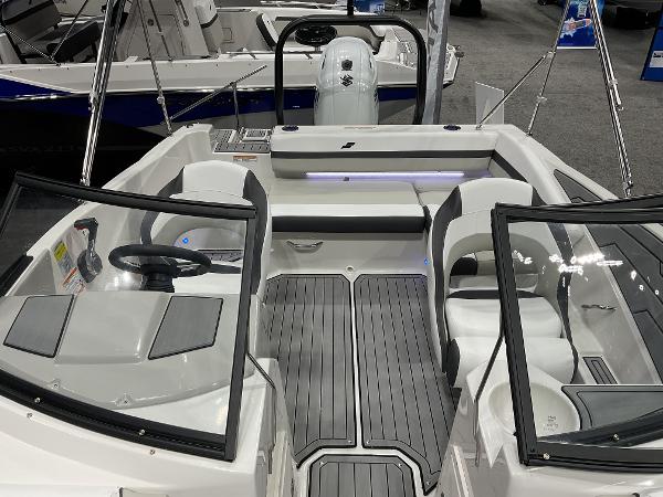 2024 Starcraft SVX 190 OB DC boat interior with dual consoles and seating.