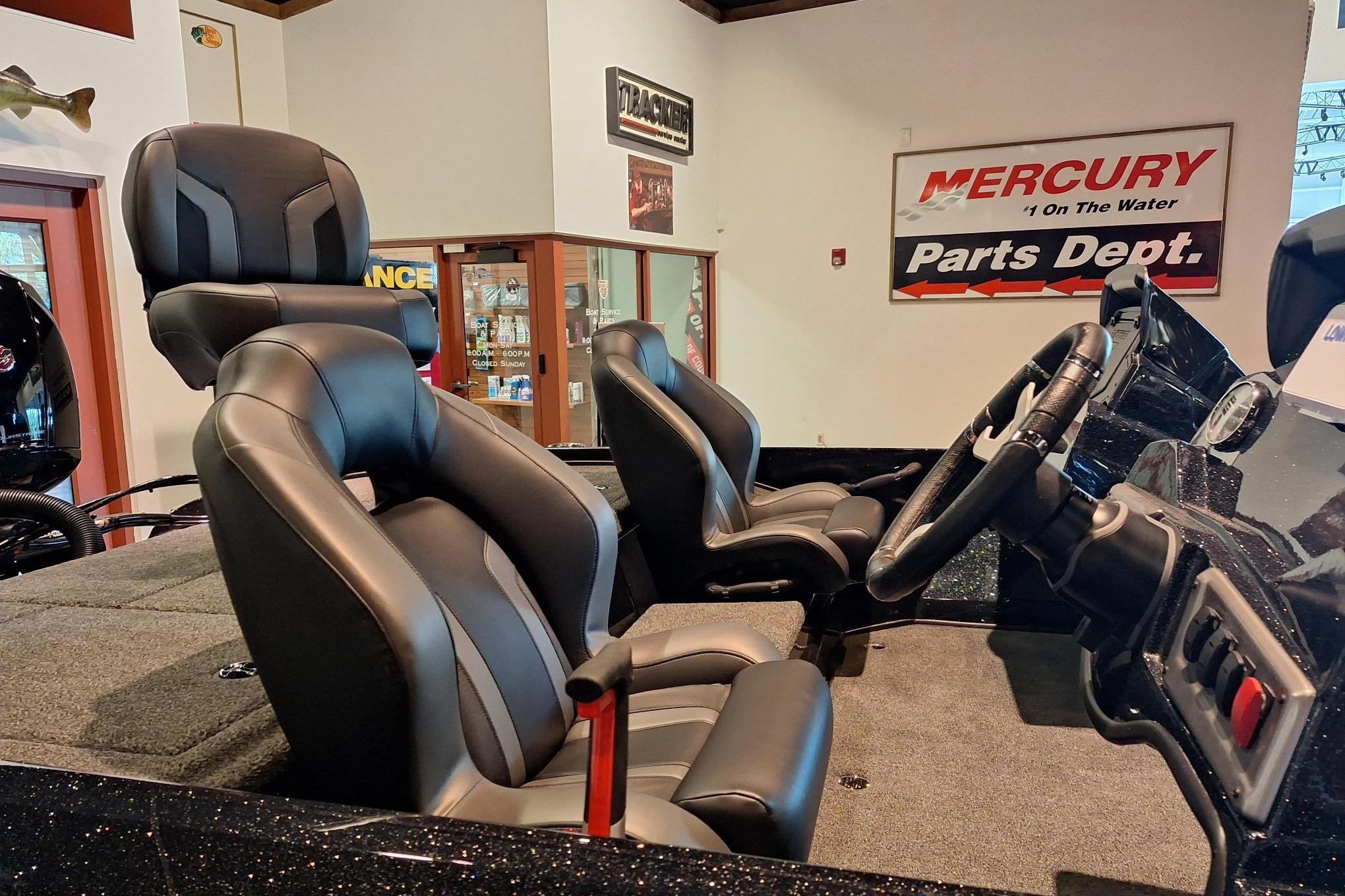 Interior of a 2026 Nitro Z18 boat with sleek black seating and steering wheel.