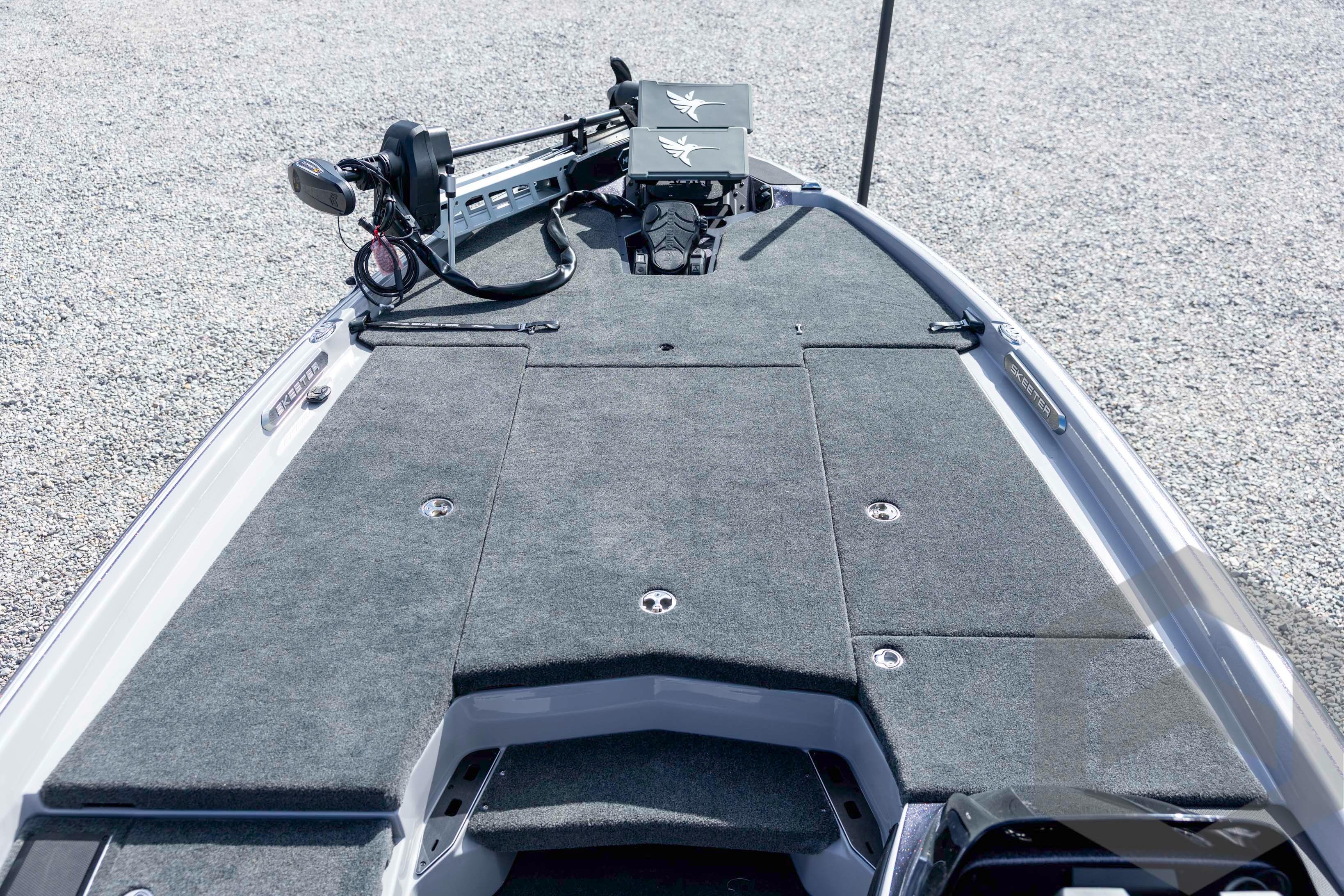 2026 Skeeter FXR20 FLEX boat deck with advanced fishing equipment and carpeted surface.