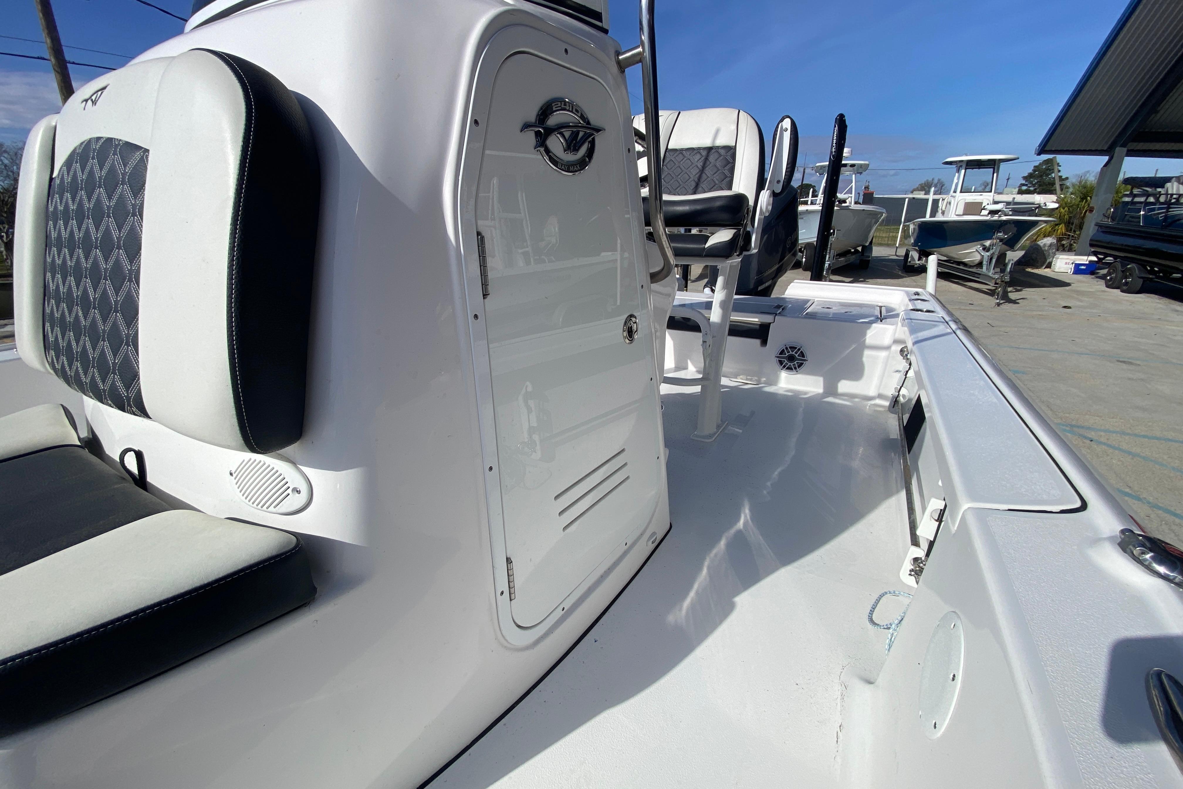 2023 Tidewater 2410 Bay Max boat interior with seating and console, showcasing modern design.