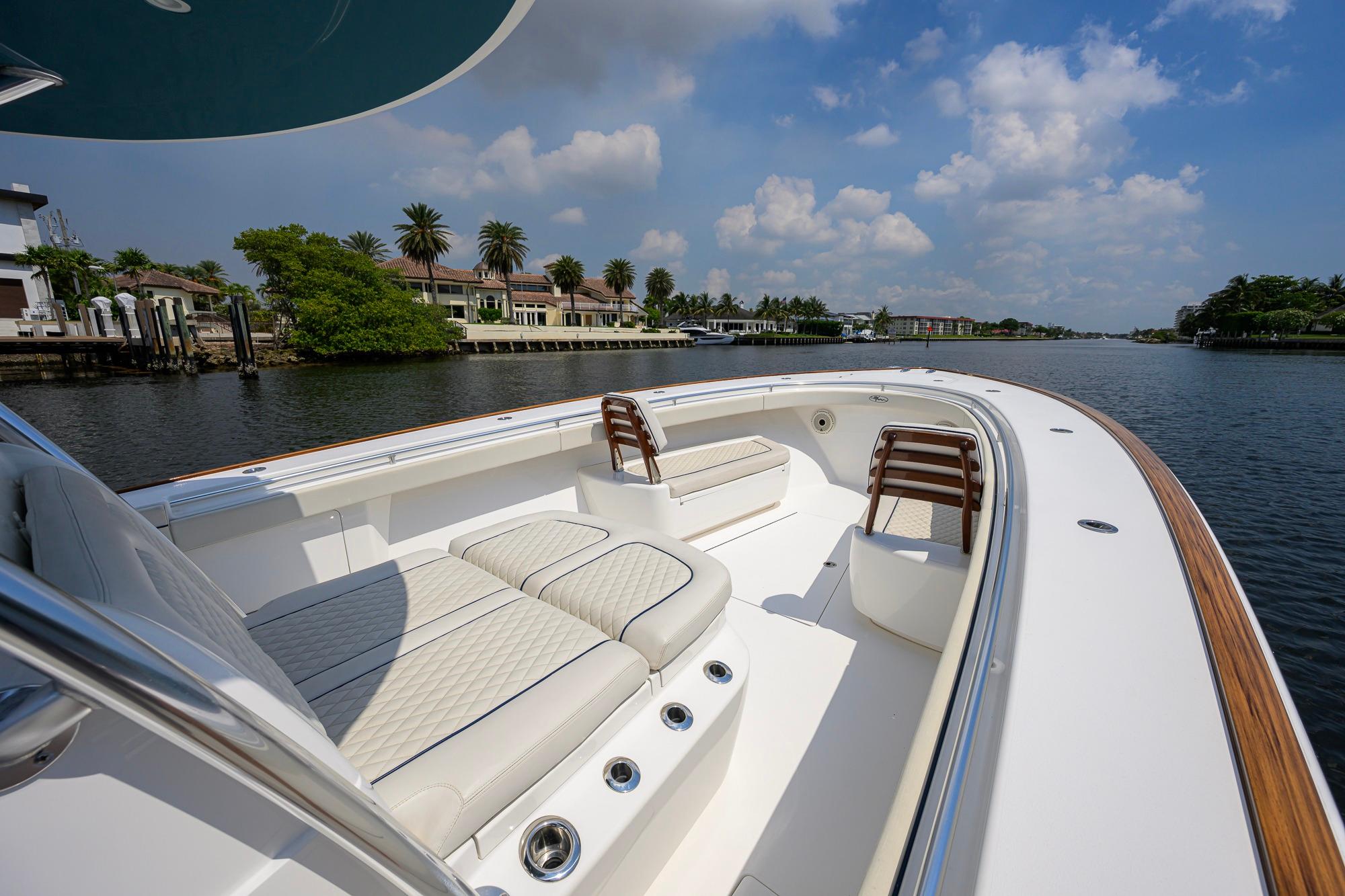 2020 Valhalla Boatworks V-41 on a scenic waterway, featuring luxurious seating and elegant design.