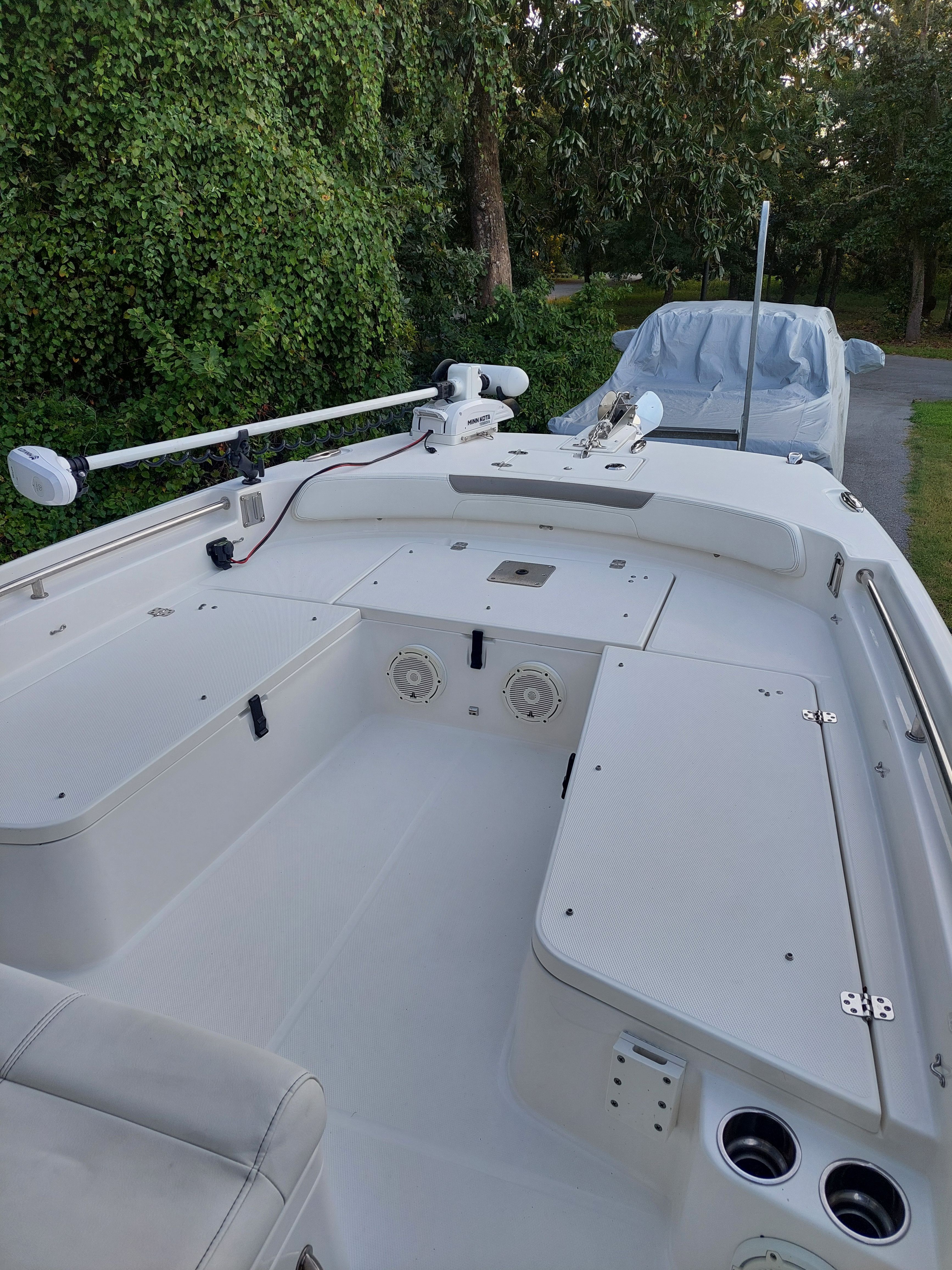 2020 World Cat 230 CC boat with spacious deck and fishing gear.