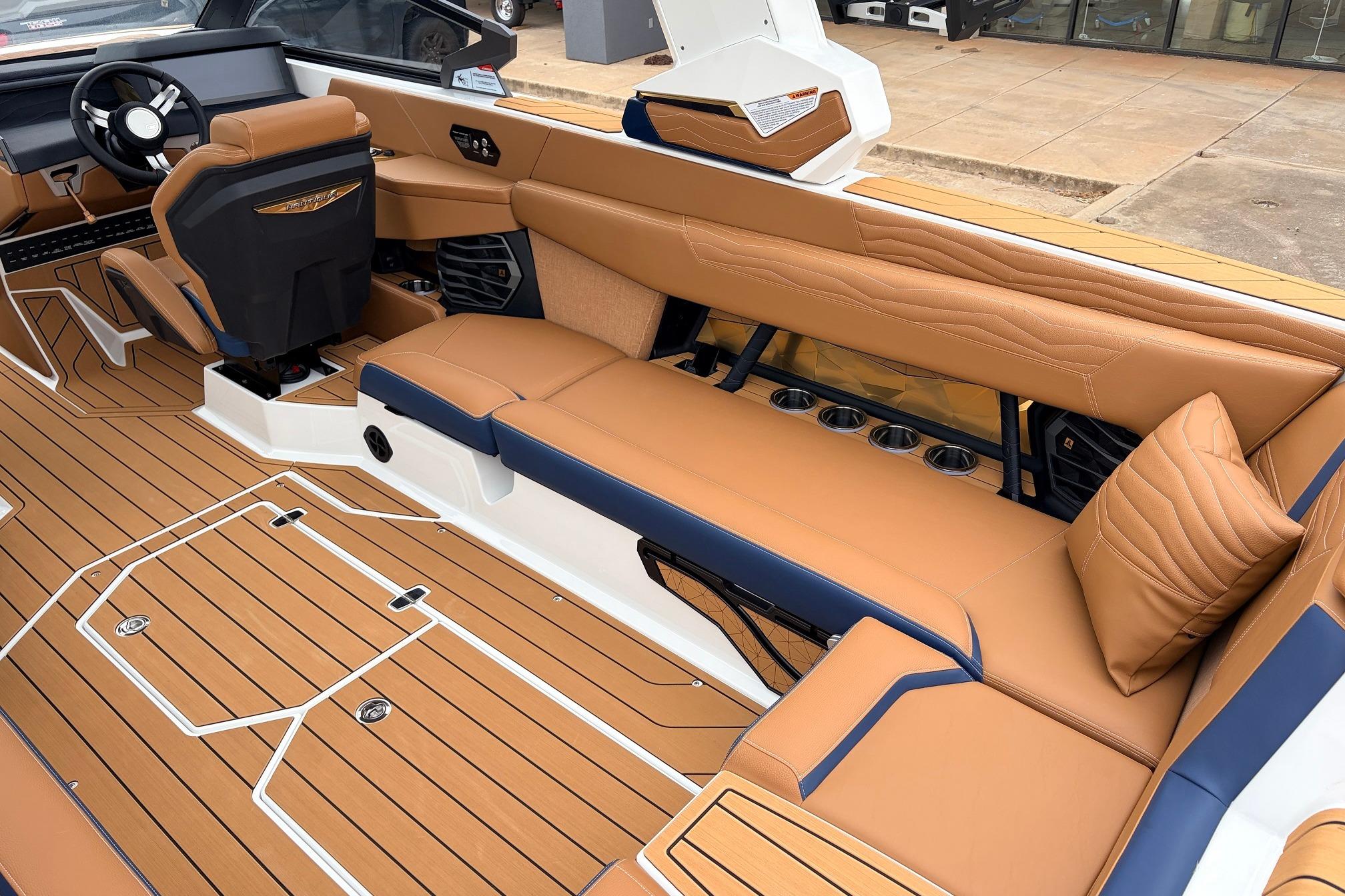 2026 Nautique Super Air Nautique G25 interior with tan leather seating and sleek design.