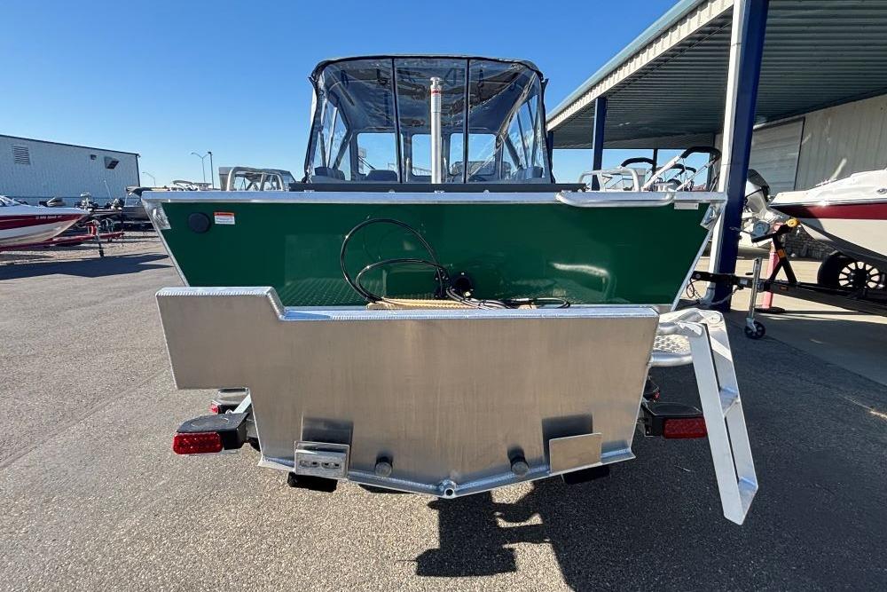 2025 Hewescraft 200 ProV ET boat, green exterior, parked in a marina.