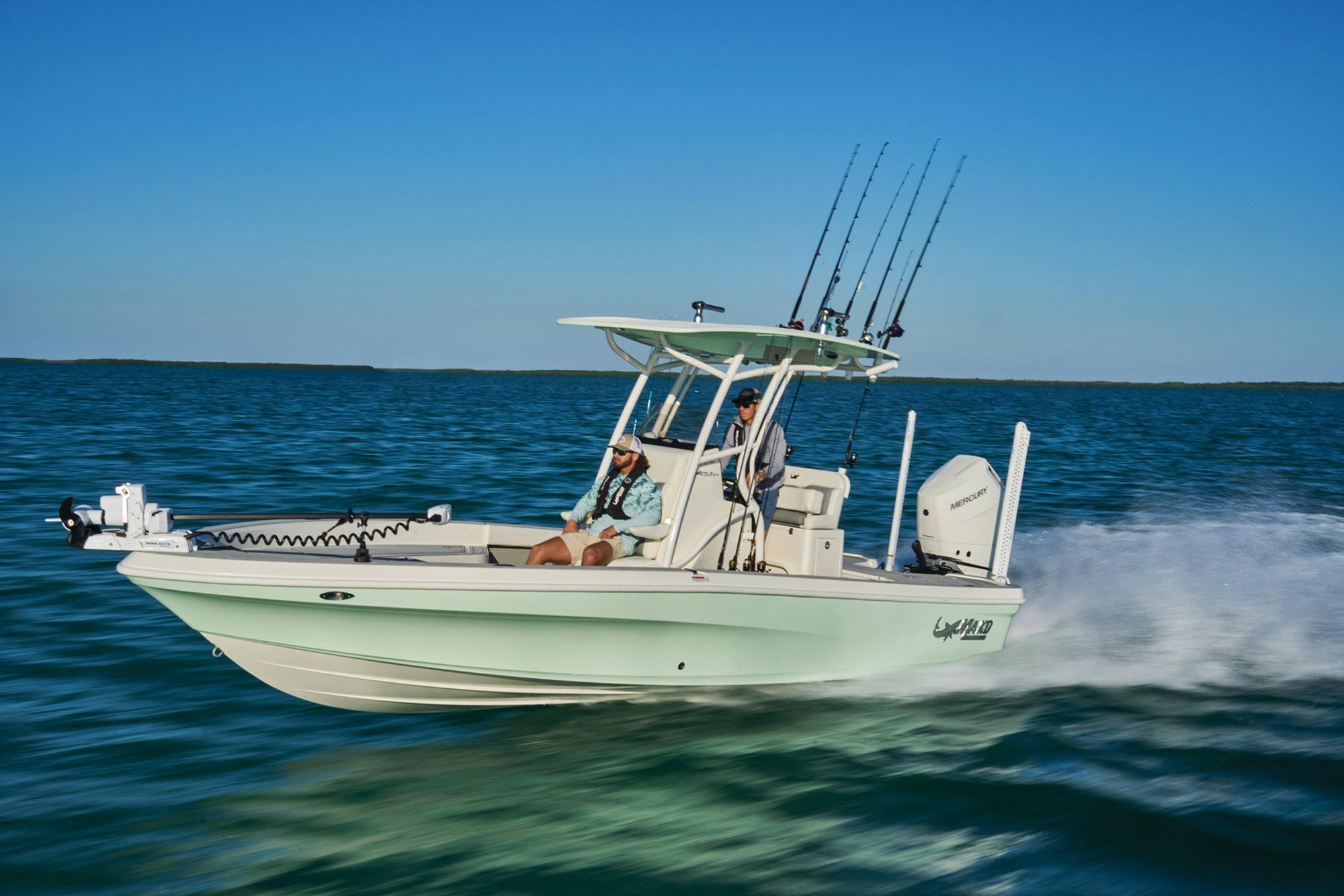 2026 Mako 24 APEX boat cruising on open water under clear blue skies.