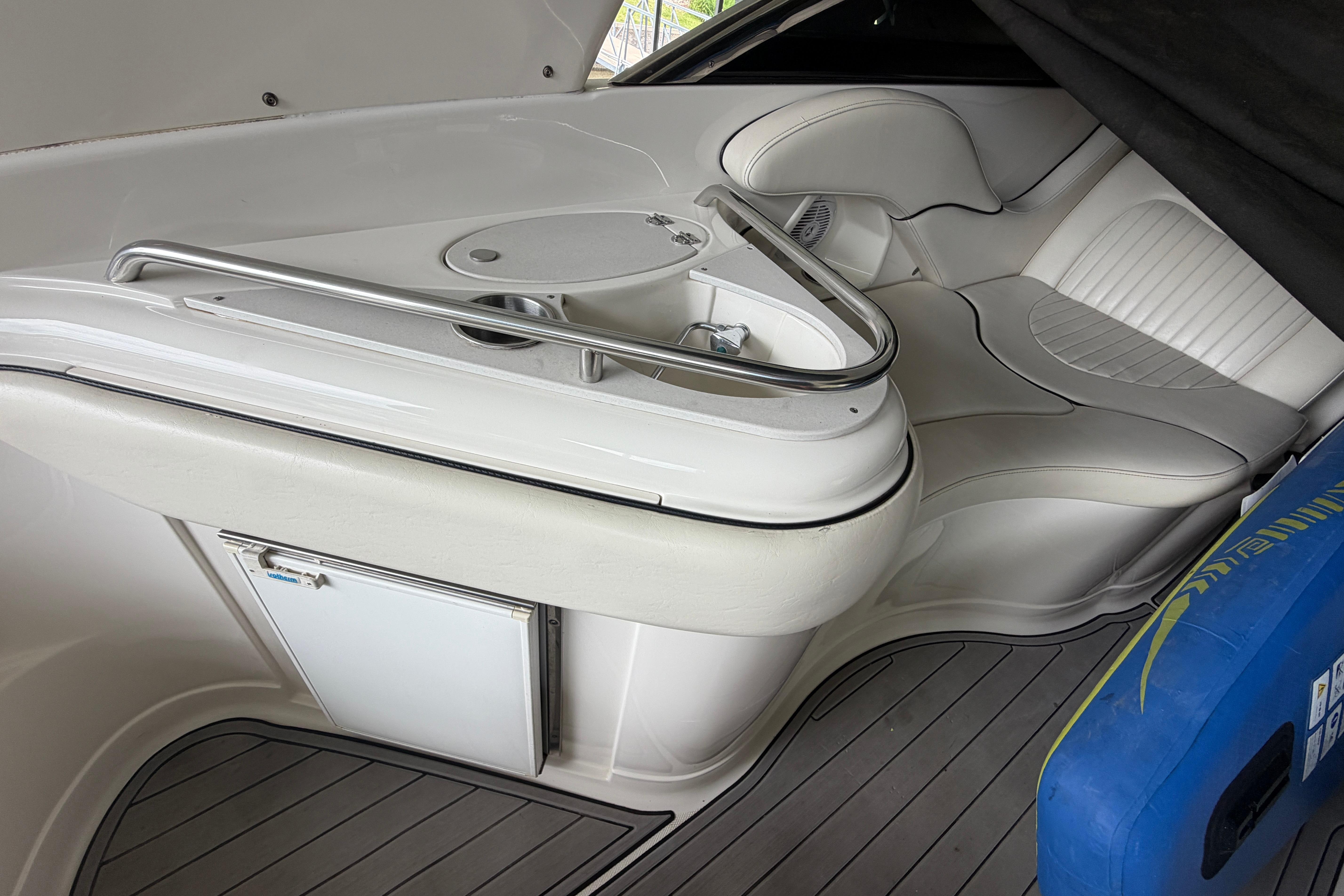 Interior of a 2007 Monterey 298SSX Super Sport boat with white seating and sleek design.