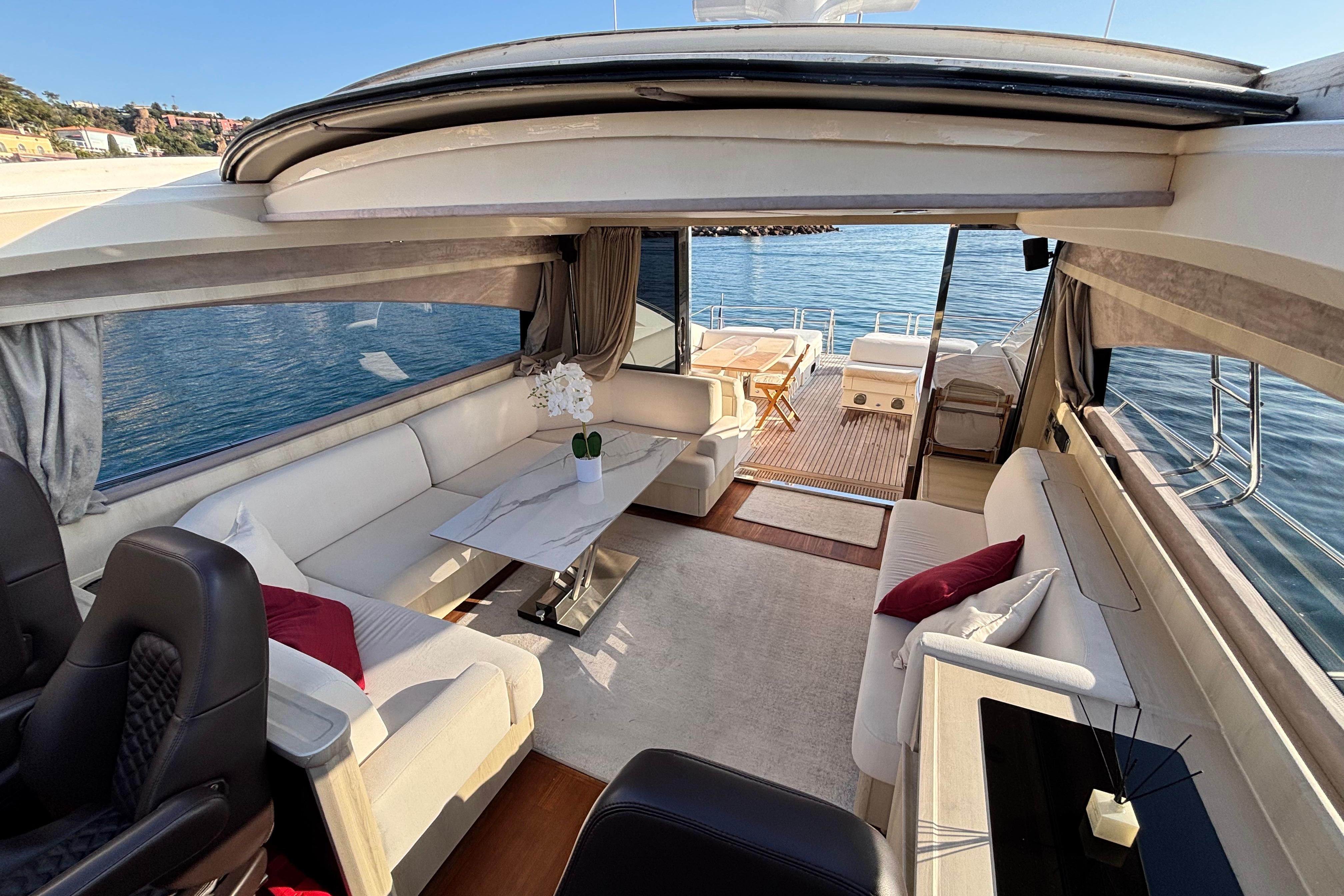 Luxurious 2006 Princess V70 yacht interior with elegant seating and ocean view.