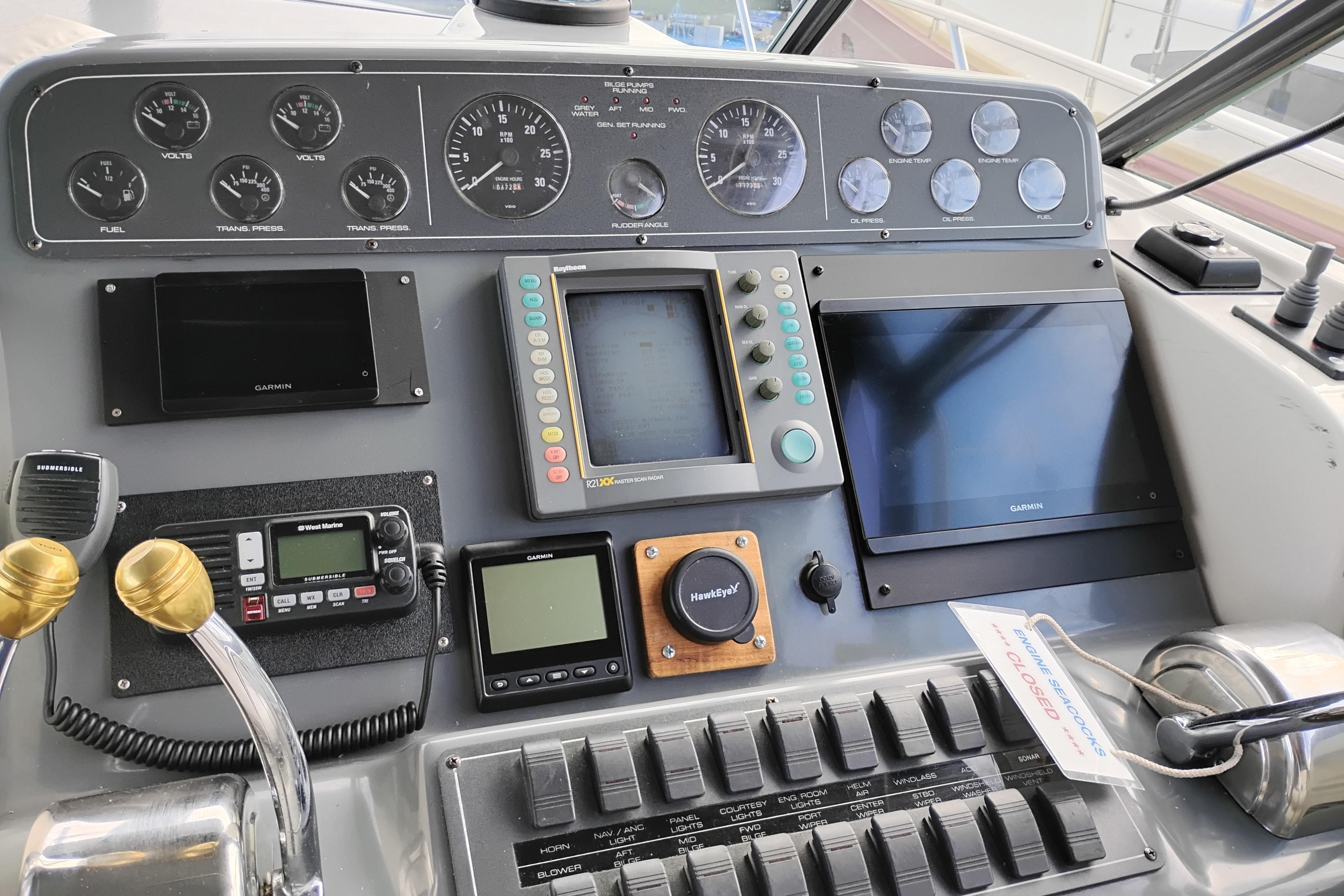 Control panel of a 1997 Tiara 3700 Open boat with navigation instruments.