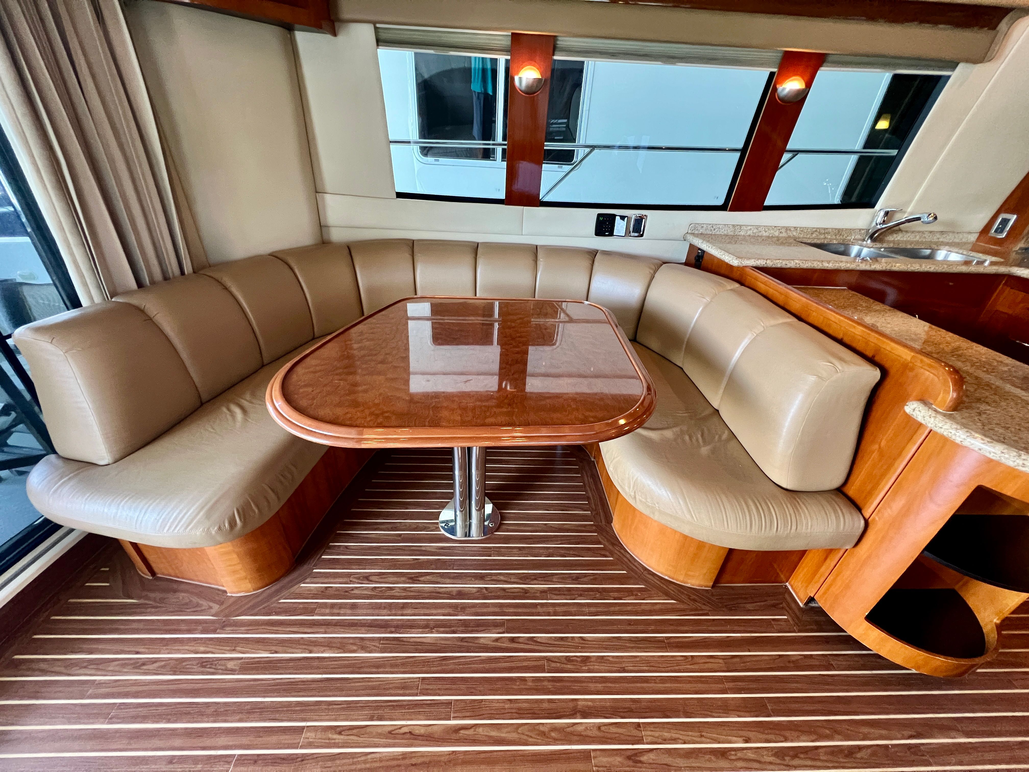 Interior of 2005 Carver 560 Voyager Sky yacht with elegant seating area.