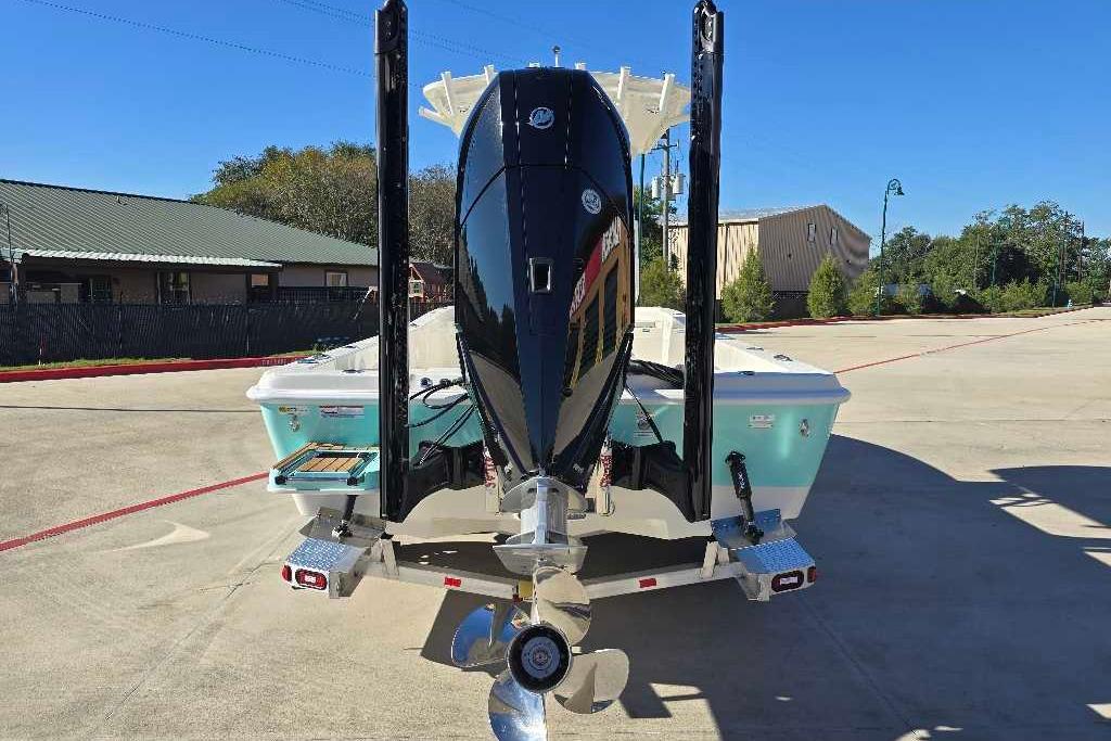 2025 Ranger 2510 Bay boat with powerful outboard motor, parked outdoors.