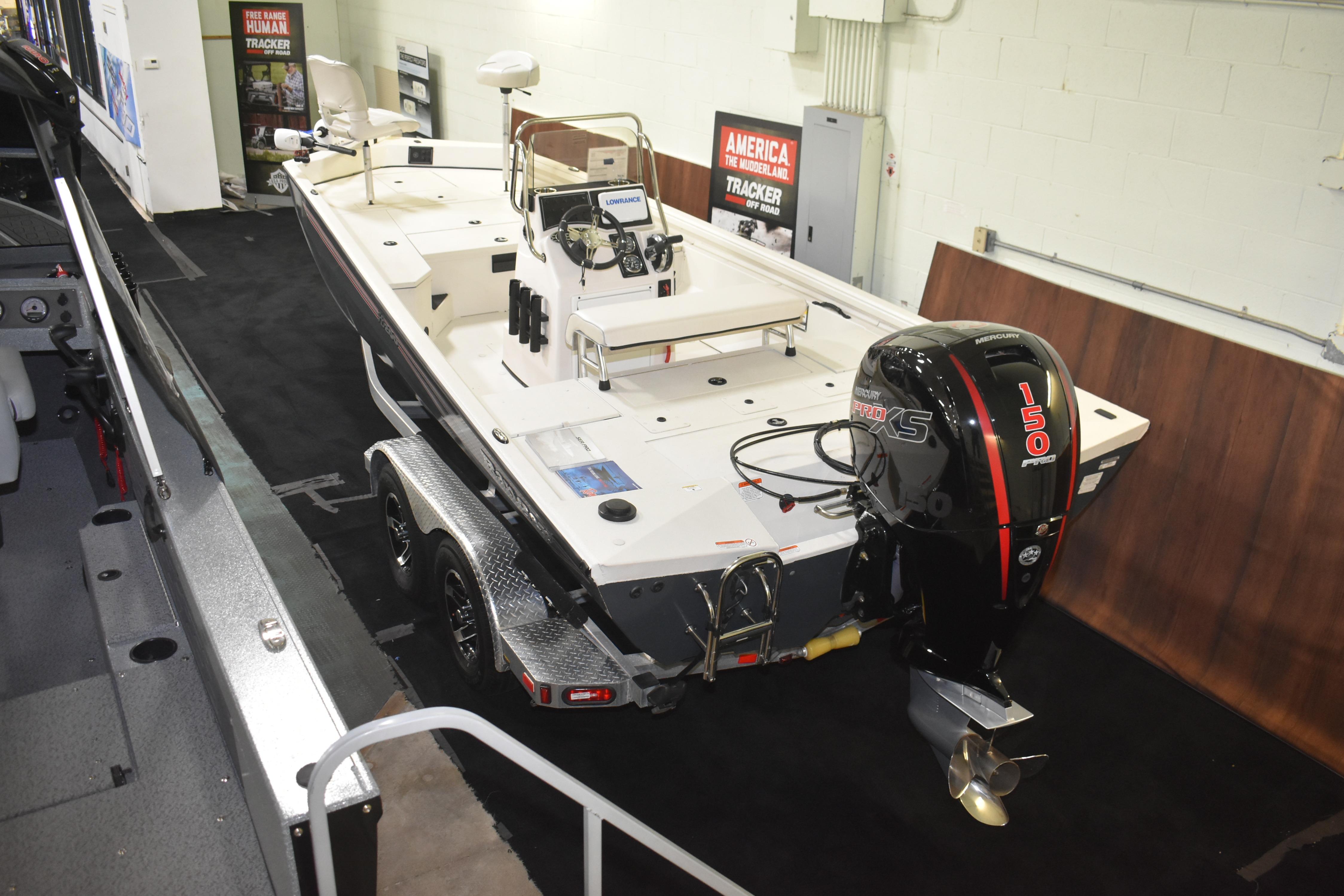 2024 Ranger RB200 boat with Mercury 150 engine displayed indoors.