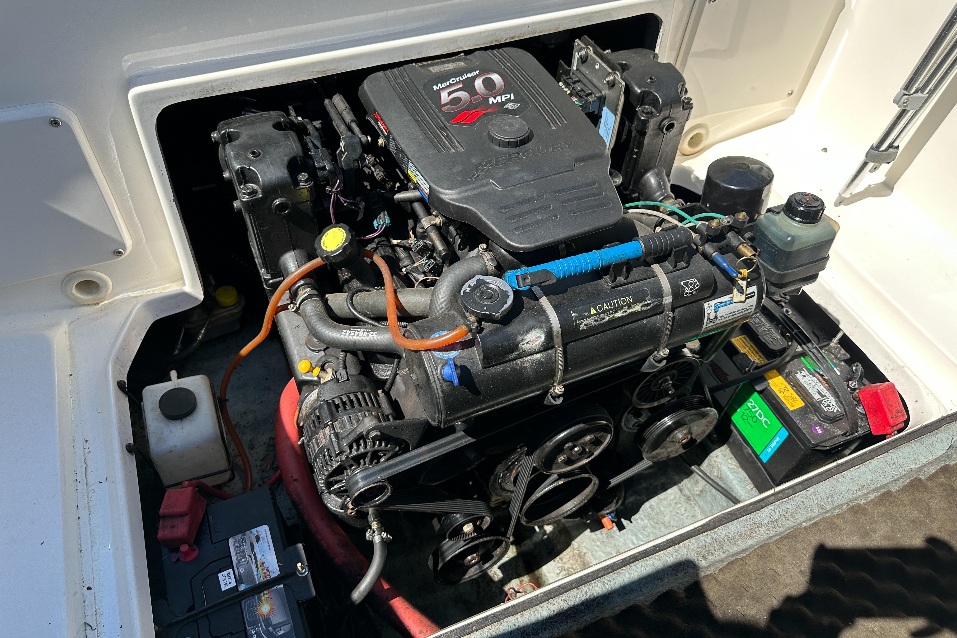 Engine compartment of a 1998 Sea Ray 215 Express Cruiser with MerCruiser 5.0 MPI engine.