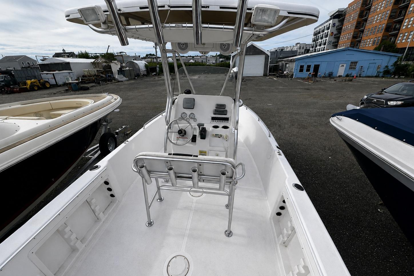 2008 PROLINE 20 Sport boat interior with steering console, docked in a marina.
