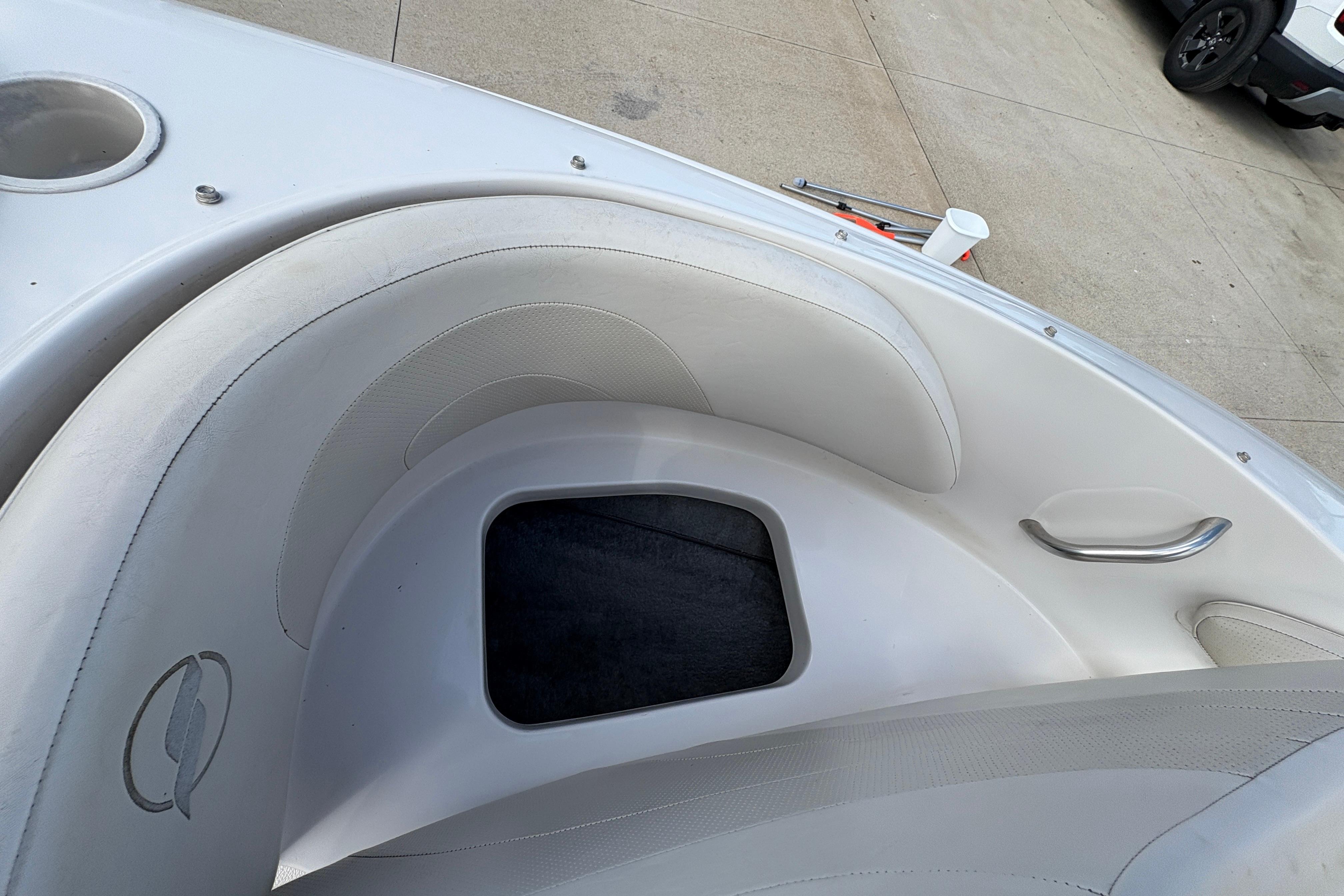 Interior of a 2005 Starcraft C-Star 1700 OB boat with white seating.