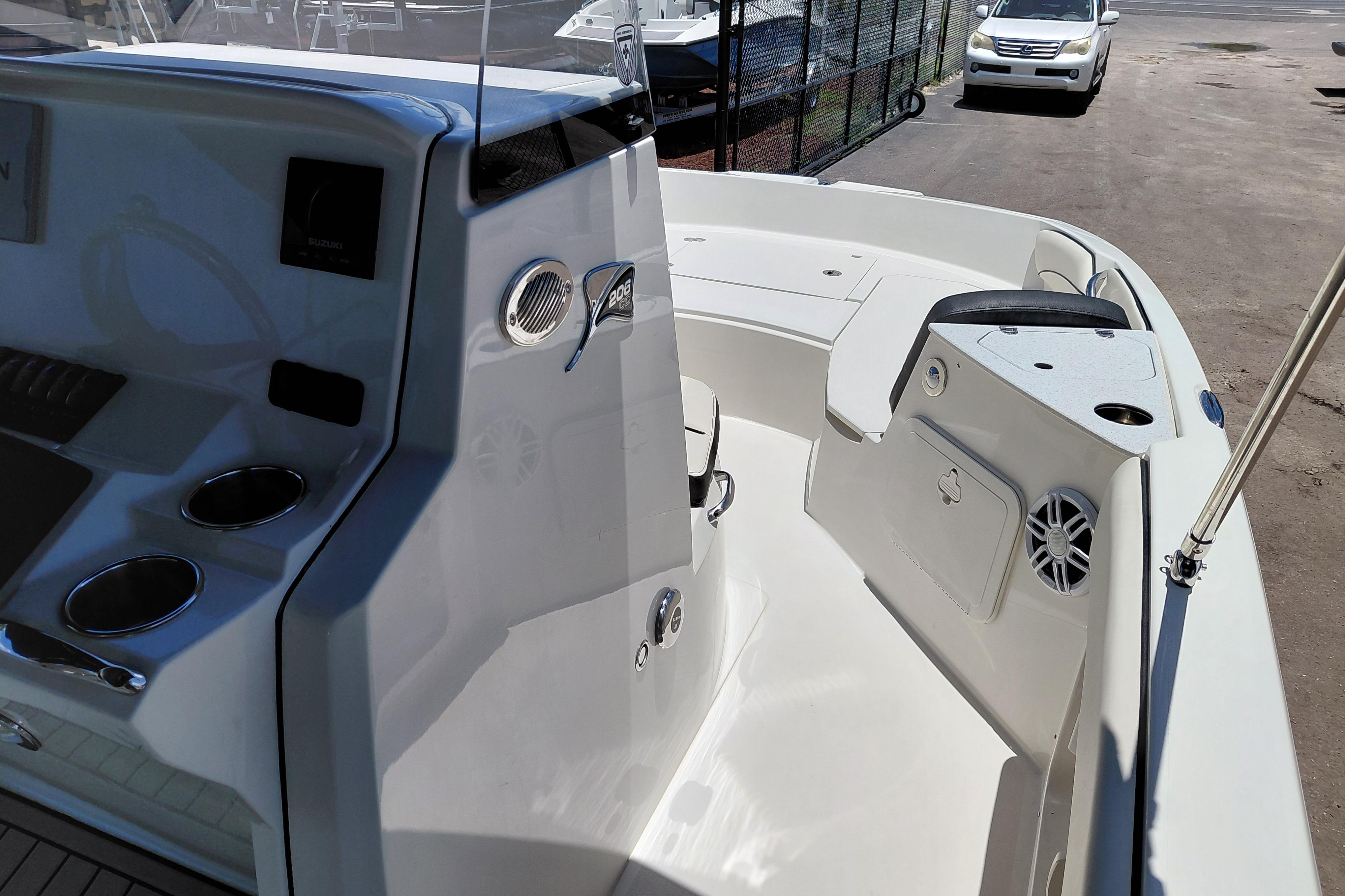 2023 Stingray 206 CC boat interior with seating, cup holders, and storage compartments.