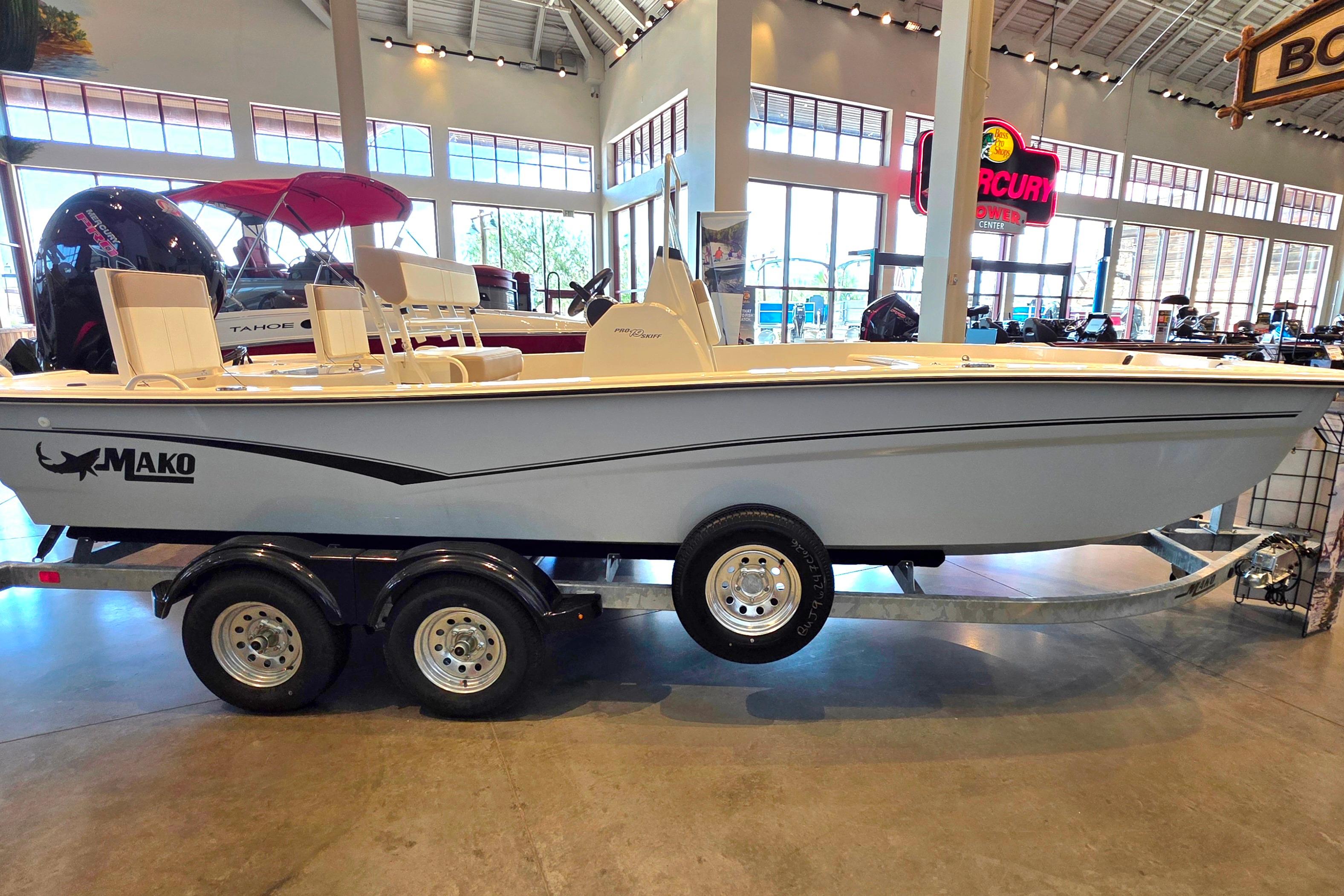 2026 Mako Pro Skiff 19 CC boat displayed indoors on a trailer.
