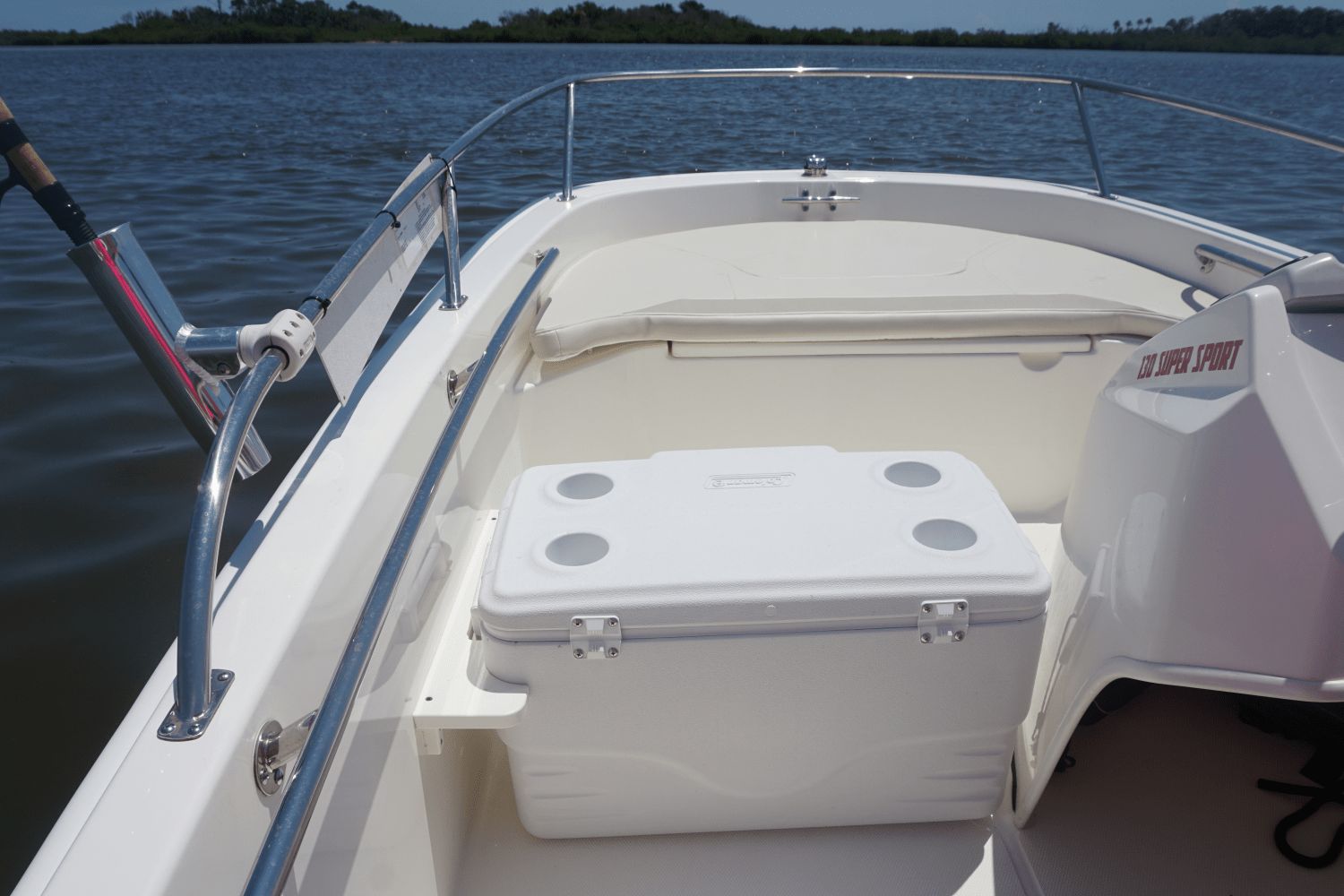 The image shows the deck of a Boston Whaler 130 Super Sport boat on the water.