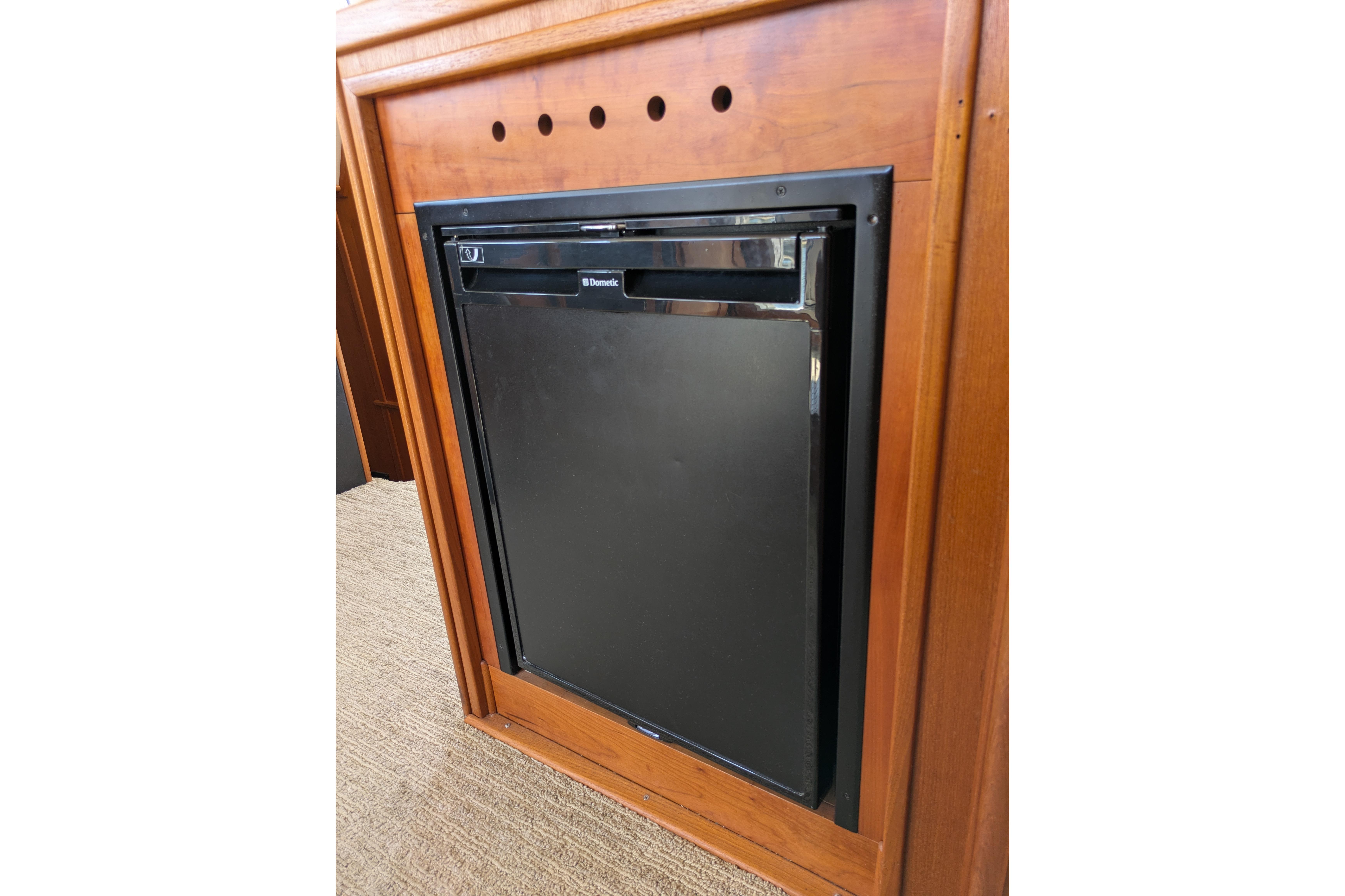 Built-in Dometic refrigerator in 2005 American Tug 41 boat interior.
