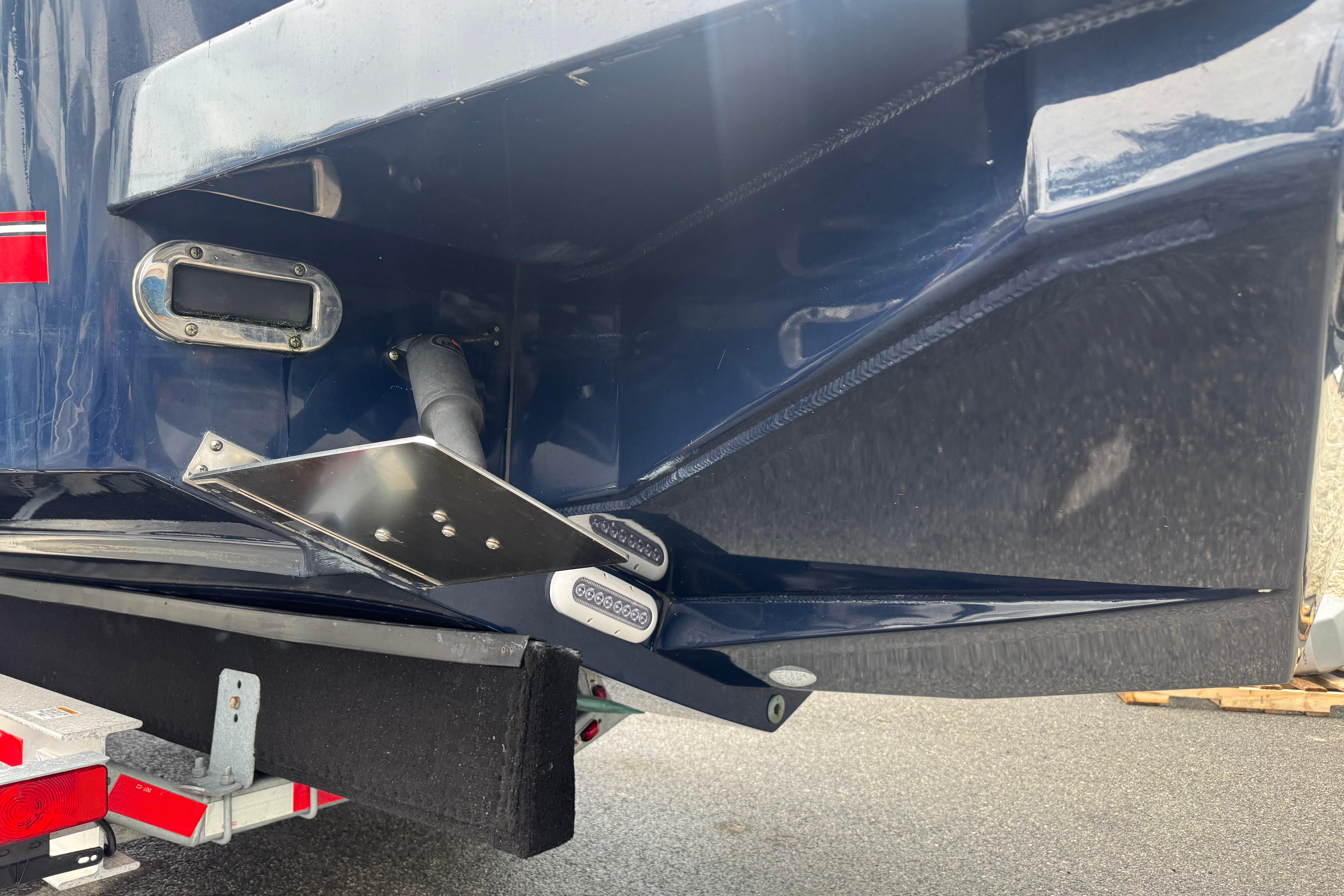 2018 Regulator 34SS boat stern detail with trim tab and trailer.