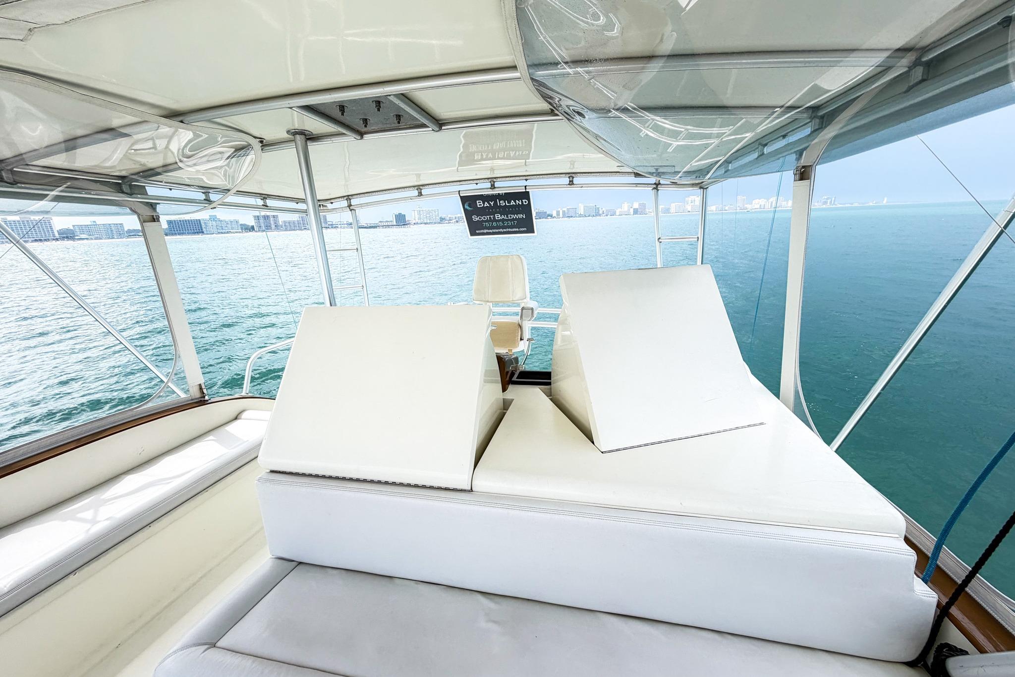 1998 Blackwell Custom Carolina Sportfish yacht interior with ocean view and white seating.