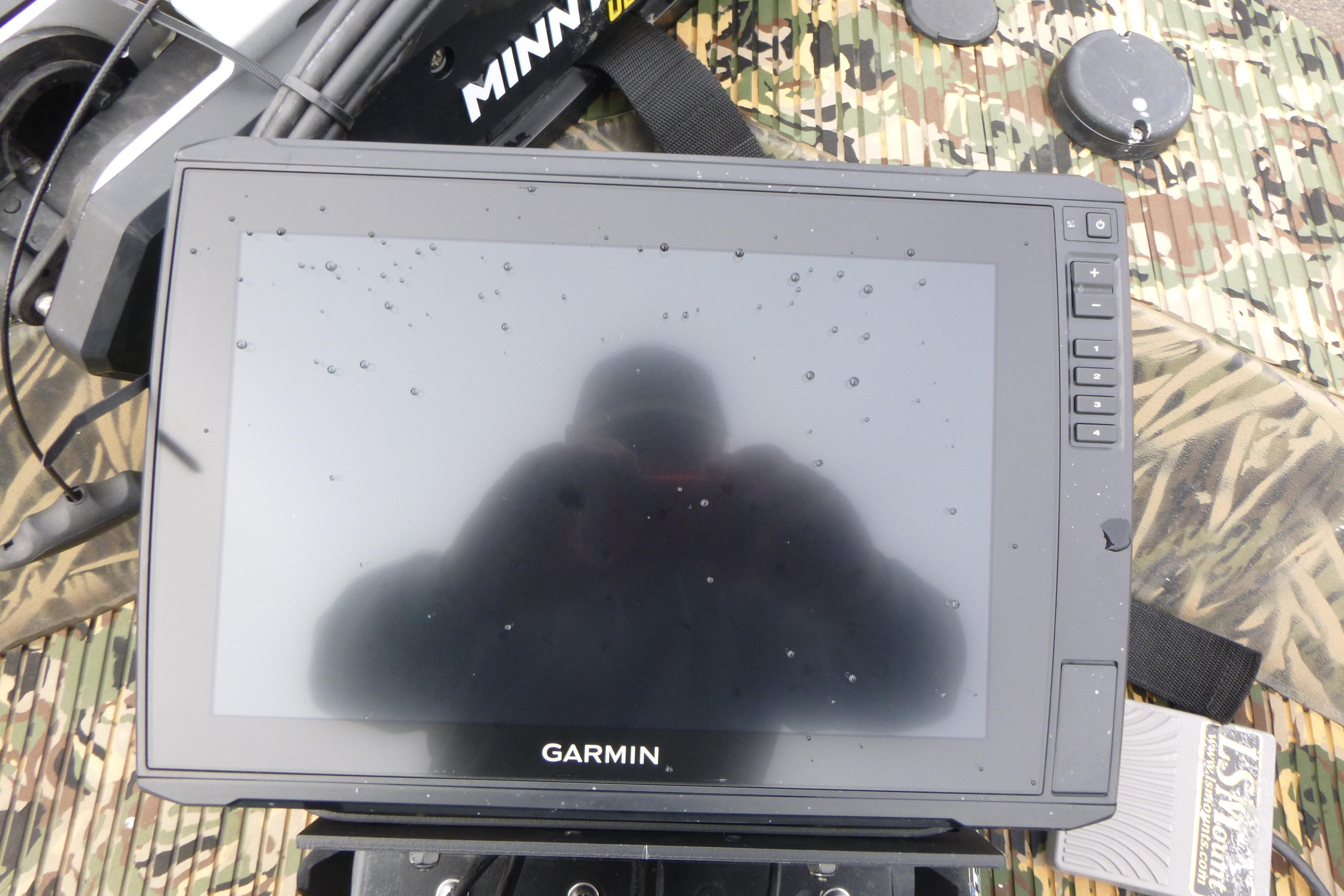 Garmin display on 2024 Lowe Roughneck 2070 boat with camo background and Minn Kota equipment.