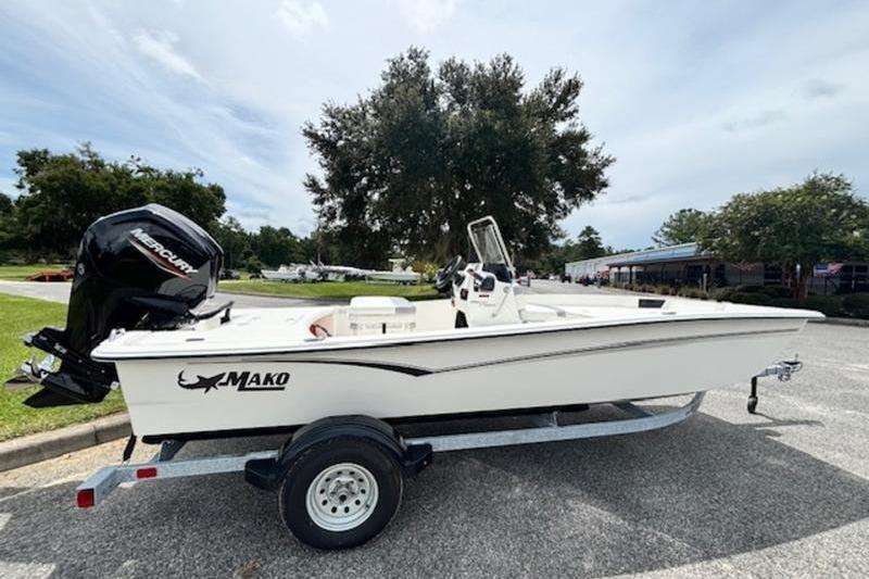 2026 Mako Pro Skiff 17 CC boat on trailer, parked outdoors.
