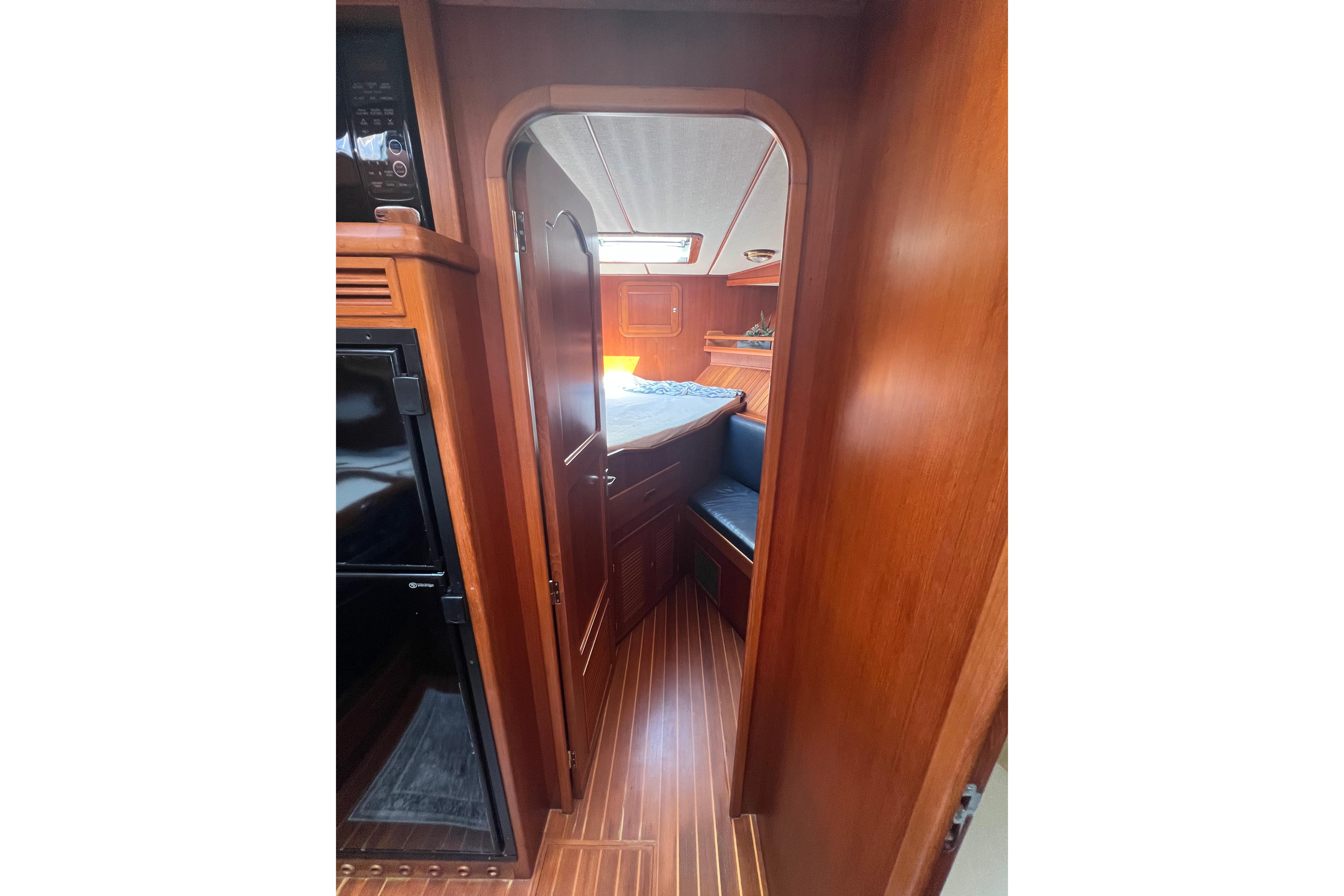 Interior of 2007 Heritage East 36 Sundeck Trawler with wood finish and cozy cabin.