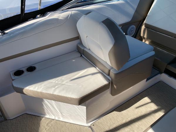 Interior of a 2017 Regal 26 Express boat with beige upholstered seating and cup holders.