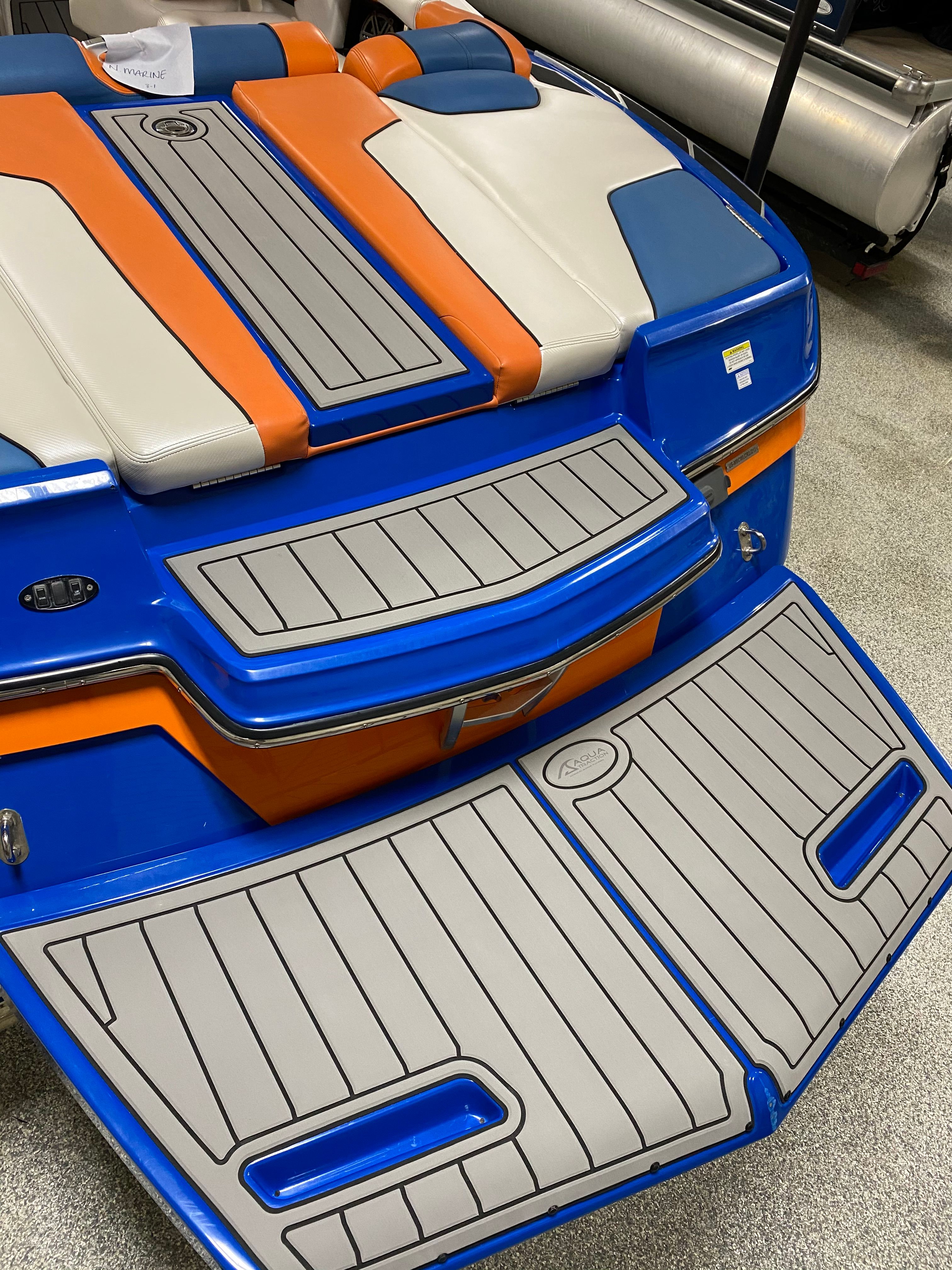 2013 MasterCraft XStar boat with colorful design.