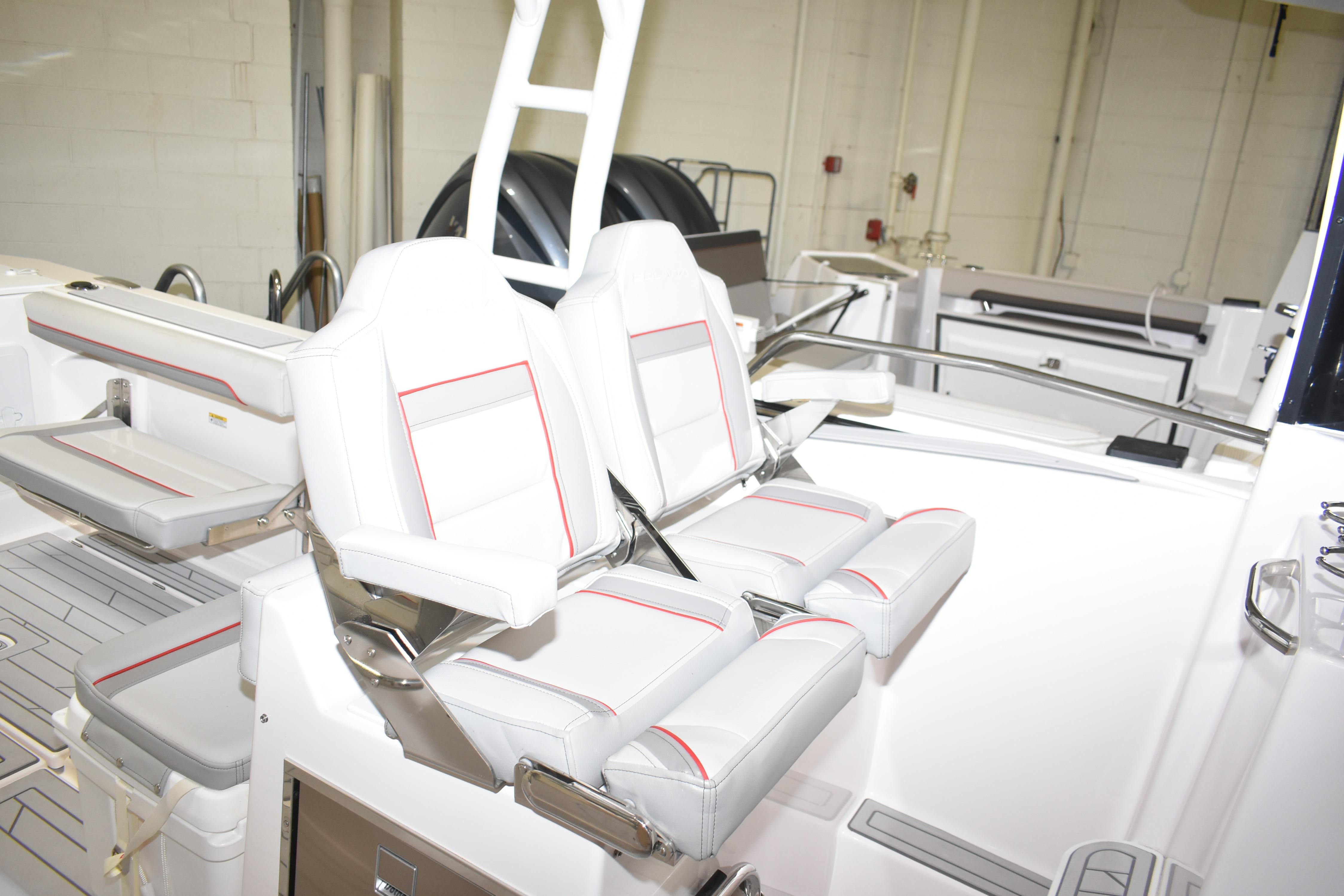 2025 Solara S-310 CW boat interior with white and red-trimmed seating.