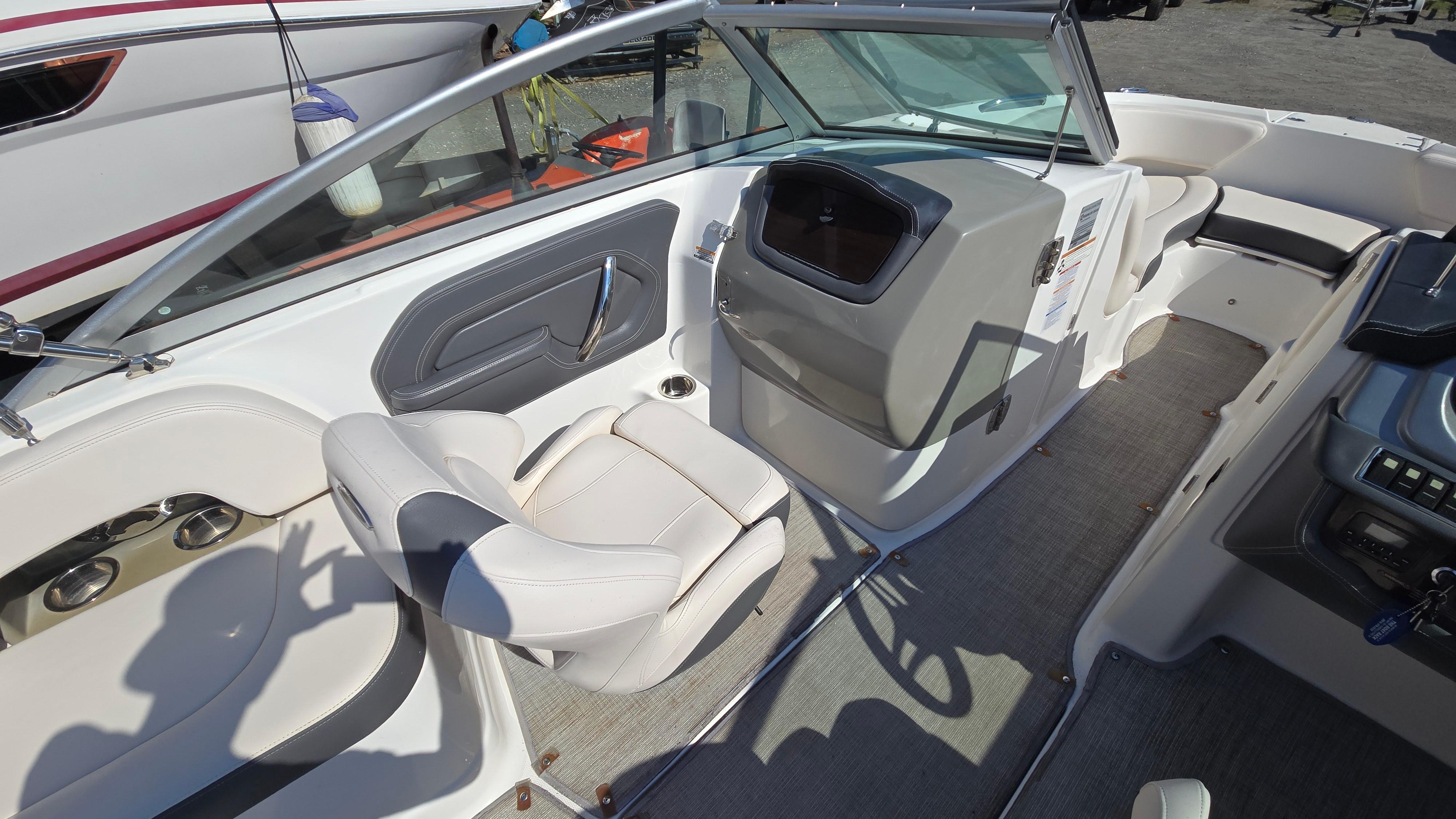 2018 Chaparral 224 Sunesta boat interior with seating and dashboard view.