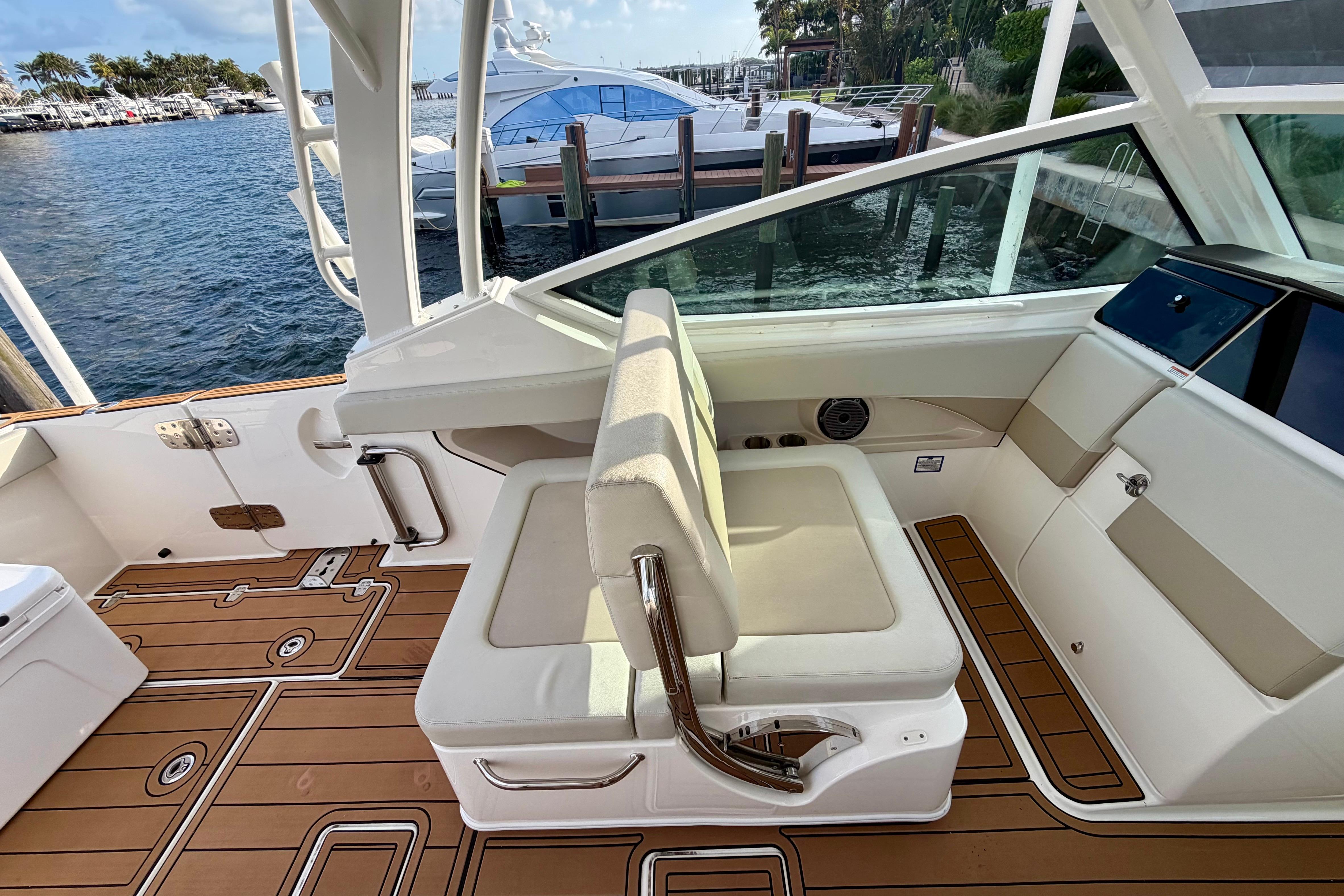 2022 Boston Whaler 280 Vantage interior with luxurious seating and teak flooring.