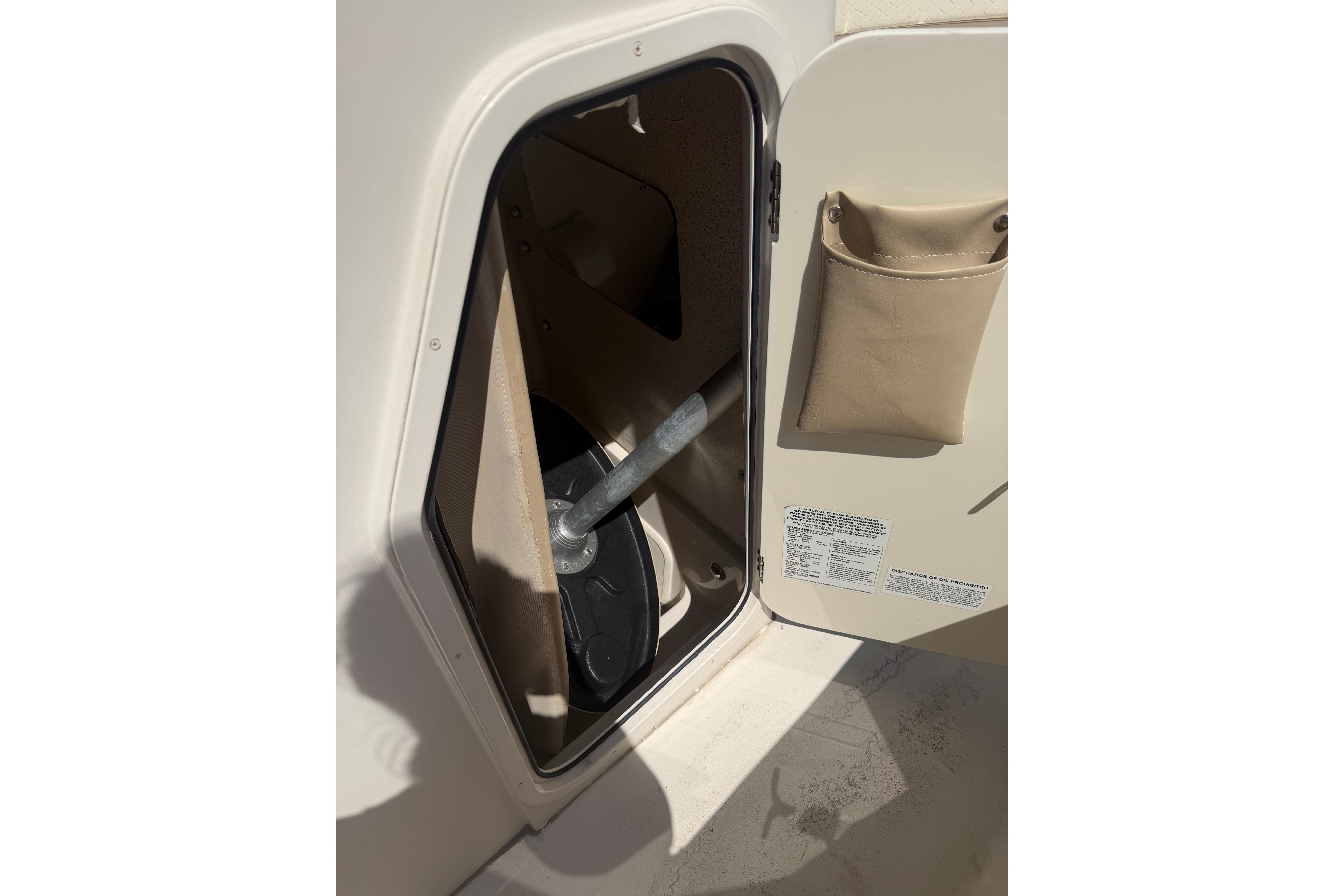 Storage compartment on a 2021 Sea Chaser 30 HFC CC boat, open with visible contents.
