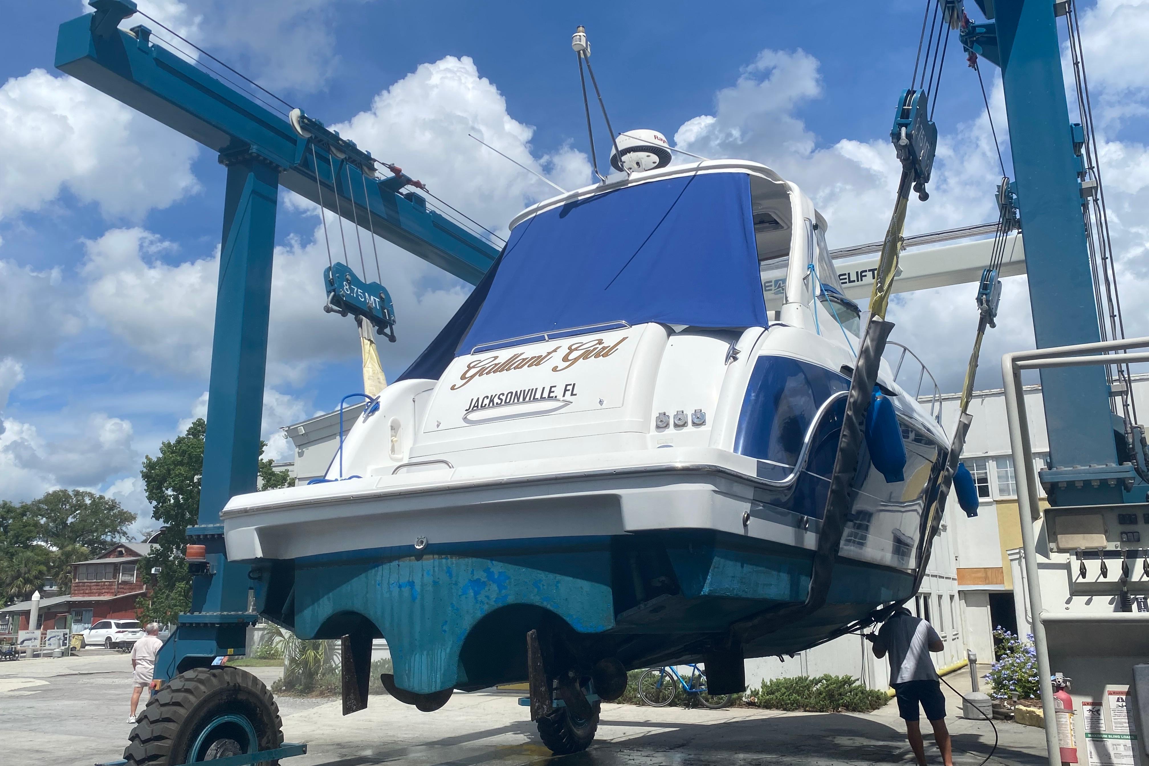 A 2005 Formula boat being lifted at a marina in Jacksonville, FL.