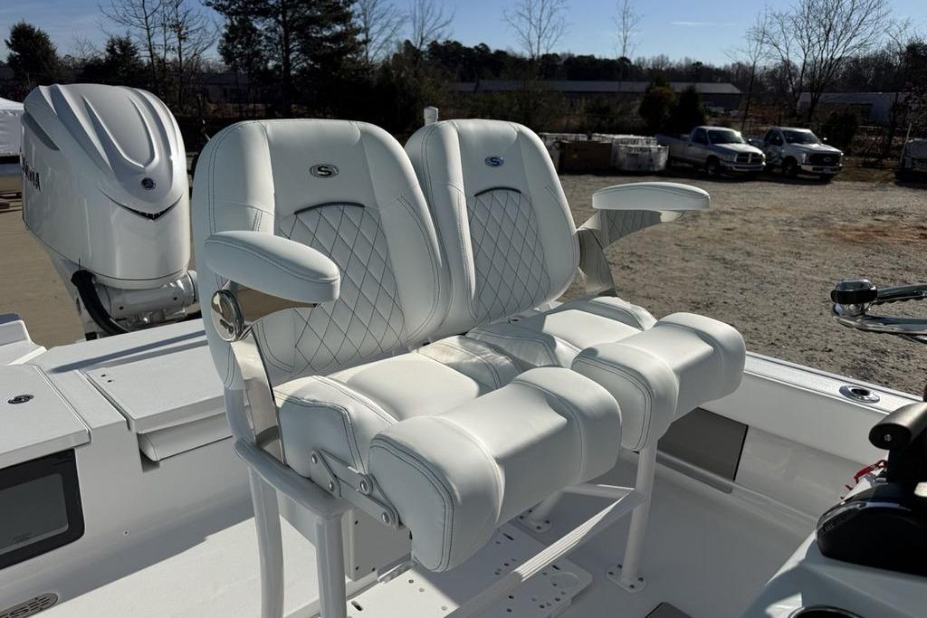 Luxurious seating on 2026 Sportsman Masters 247OE Bay Boat with white leather upholstery.