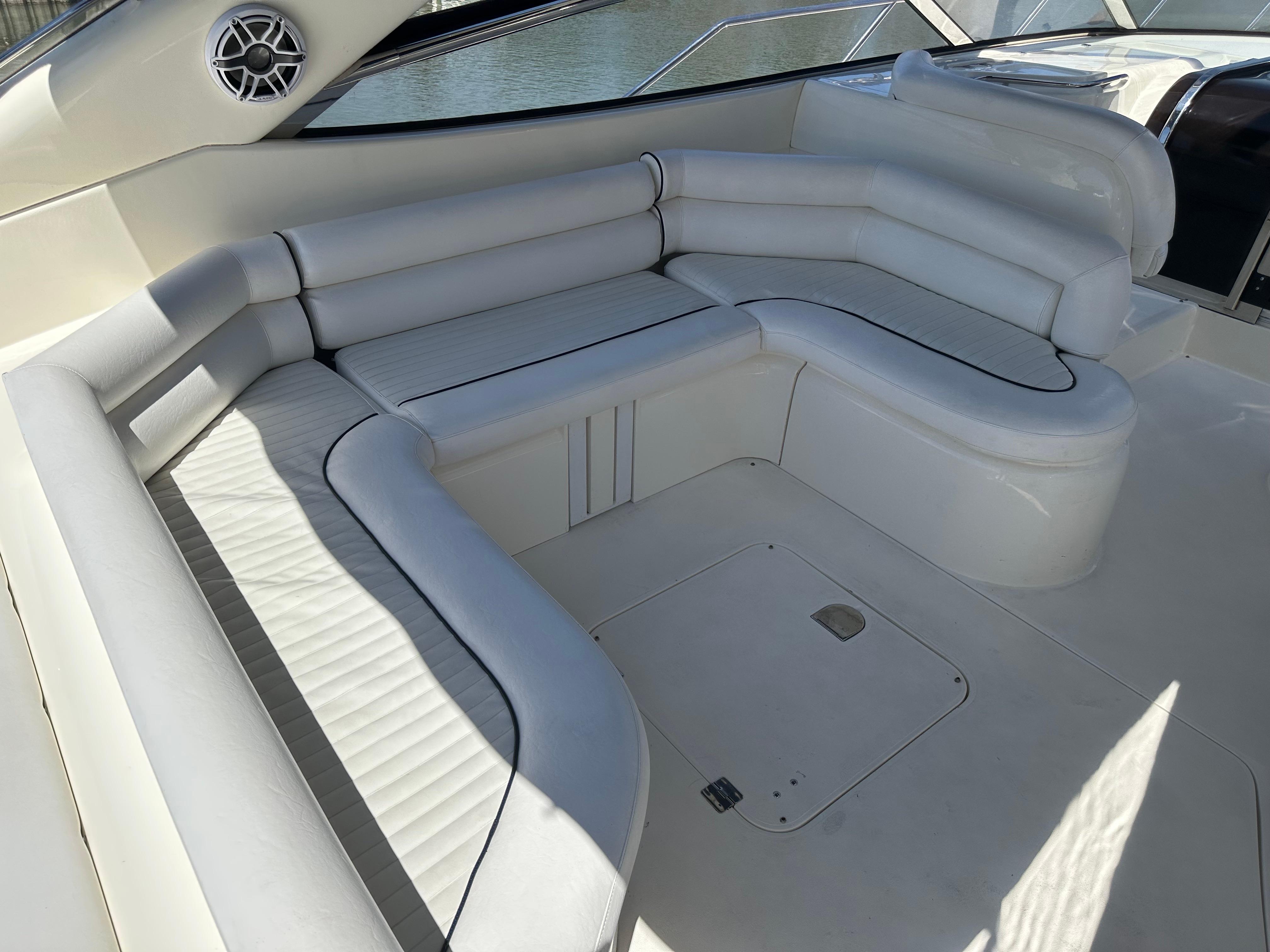 Luxurious white seating area on a 1997 Sunseeker Camargue 47 yacht.